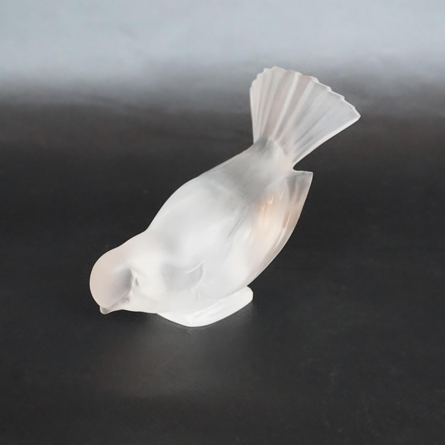 Moineau Hardi, an Art Deco glass bird paperweight by René Lalique (1860-1945). A frosted glass figure of a sparrow pecking for food. Model number 1150. Stencil etched R Lalique France to underside. (Etching very faint and not visible with