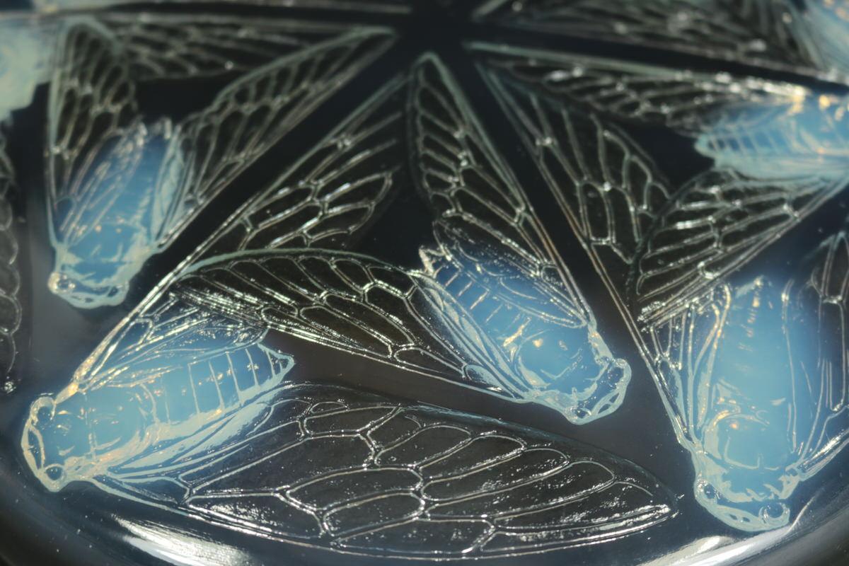 Rene Lalique opalescent glass 'Cigales' box. This pattern features cicadas, the flying insects, whose charming, chirping sound fills the air in some hot regions. Moulded maker's mark, 'R LALIQUE', and enscribed, 'France'. Book reference: Marcilhac