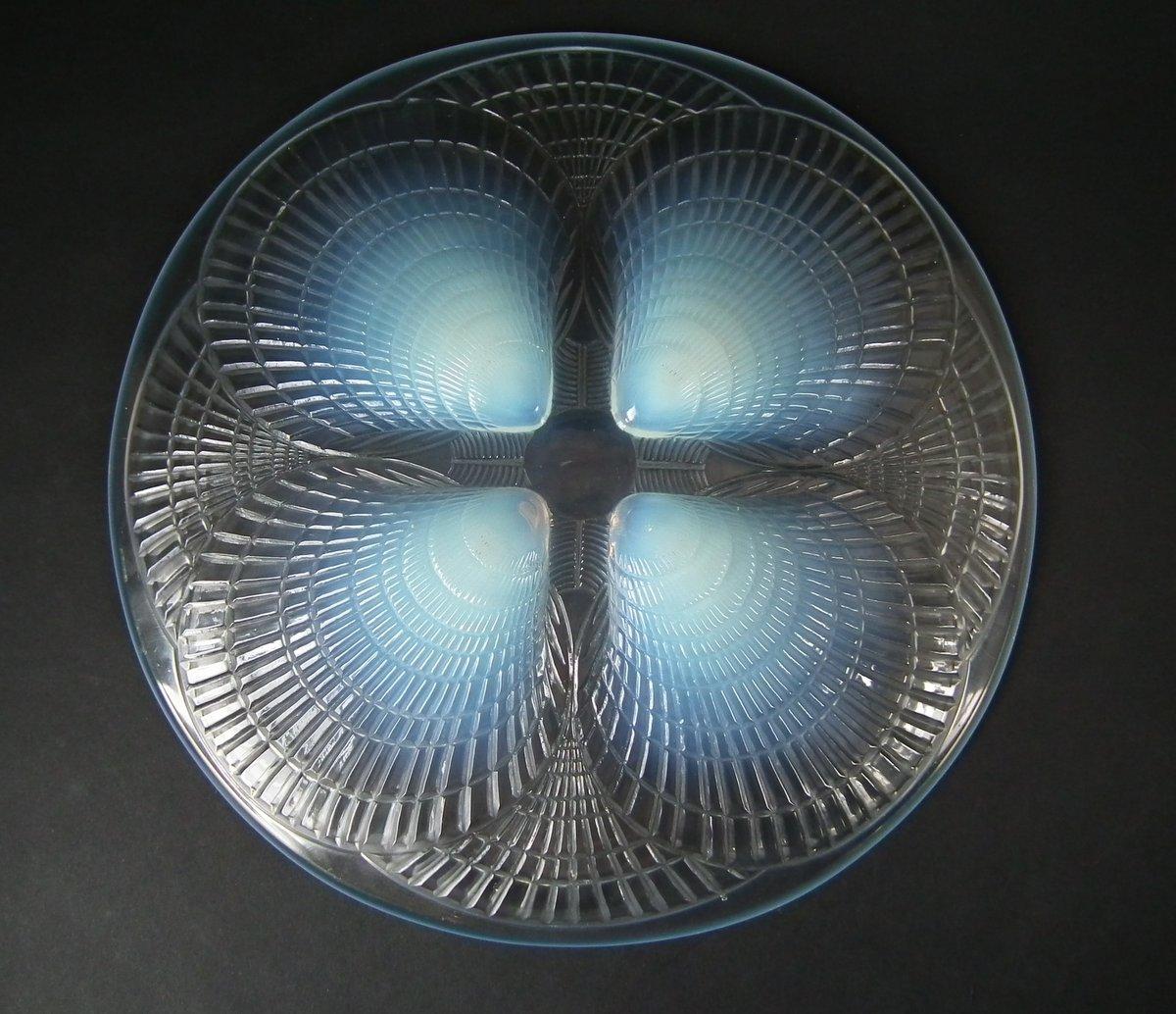 René Lalique opalescent glass 'Coquilles No 1' plate. Pattern features a cockle shells design. Molded makers mark, 'R LALIQUE'. Book reference: Marcilhac 3009.
 