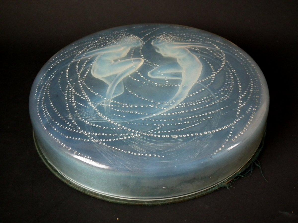Rene Lalique opalescent glass 'Deux Sirenes' box. This pattern features mermaids. The top sits on the original, silk lined card base. Moulded makers mark, 'R. Lalique '. Book reference: Marcilhac 43.