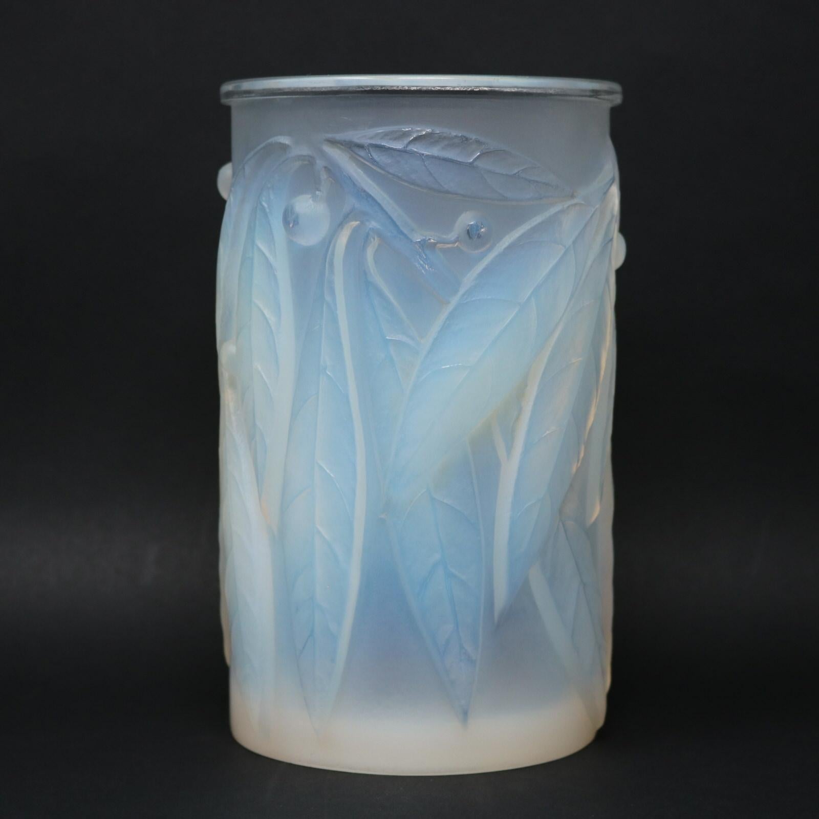 Rene Lalique opalescent glass 'Laurier' vase. This pattern features laurel leaves and berries. Makers mark, 'R LALIQUE FRANCE' wheel cut to side. Engraved, 'No 947' pattern number to the underside. Book reference: Marcilhac 947.