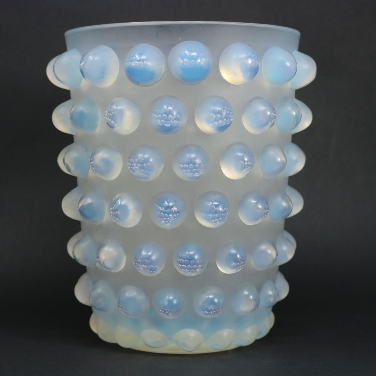 René Lalique opalescent glass Mossi vase. The vase is decorated around the outside with raised, hemispherical bubbles. When you look into the bubbles, they beautifully relect/refract bubbles from all around the vase. Stenciled makers mark, 'R.