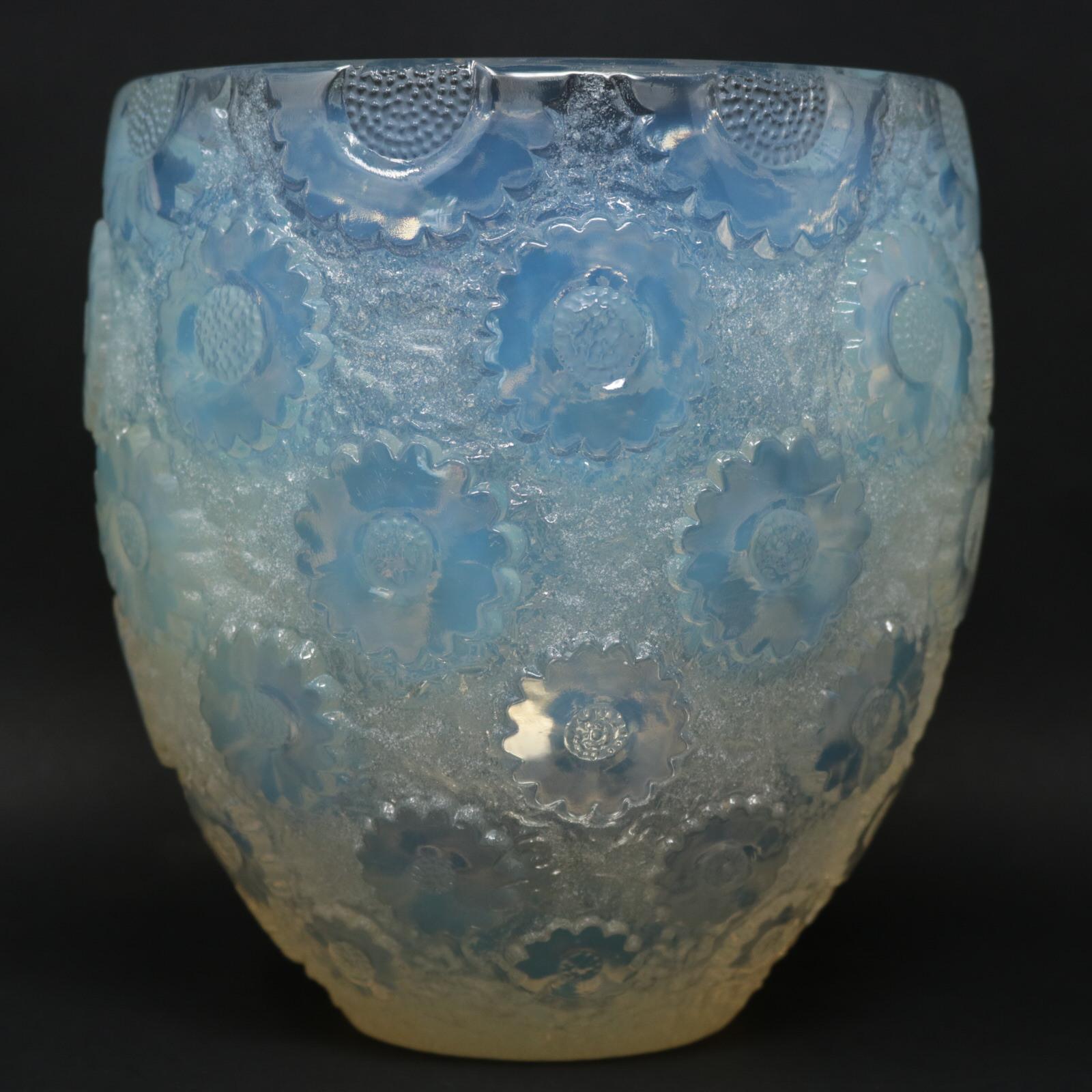 René Lalique opalescent glass 'Paquerettes' vase. This pattern features daisies in relief around the outside. Stenciled makers mark, 'R LALIQUE FRANCE' to the underside. Book reference: Marcilhac 10-877.