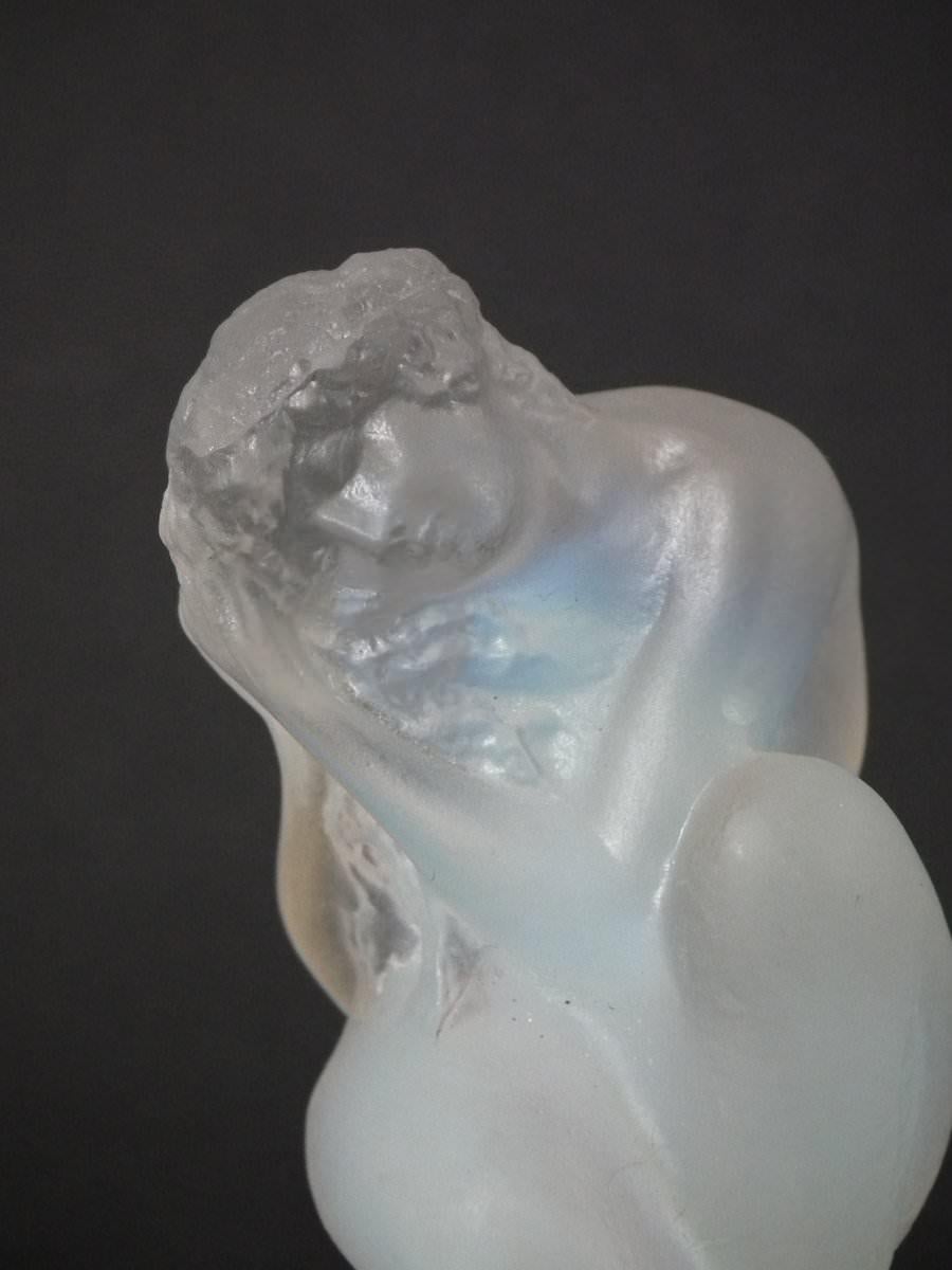 Rene Lalique Opalescent Glass 'Sirene' Statuette. This model features a mermaid in a crouching pose. Moulded makers mark, 'R Lalique'. Book reference: Marcilhac 831.