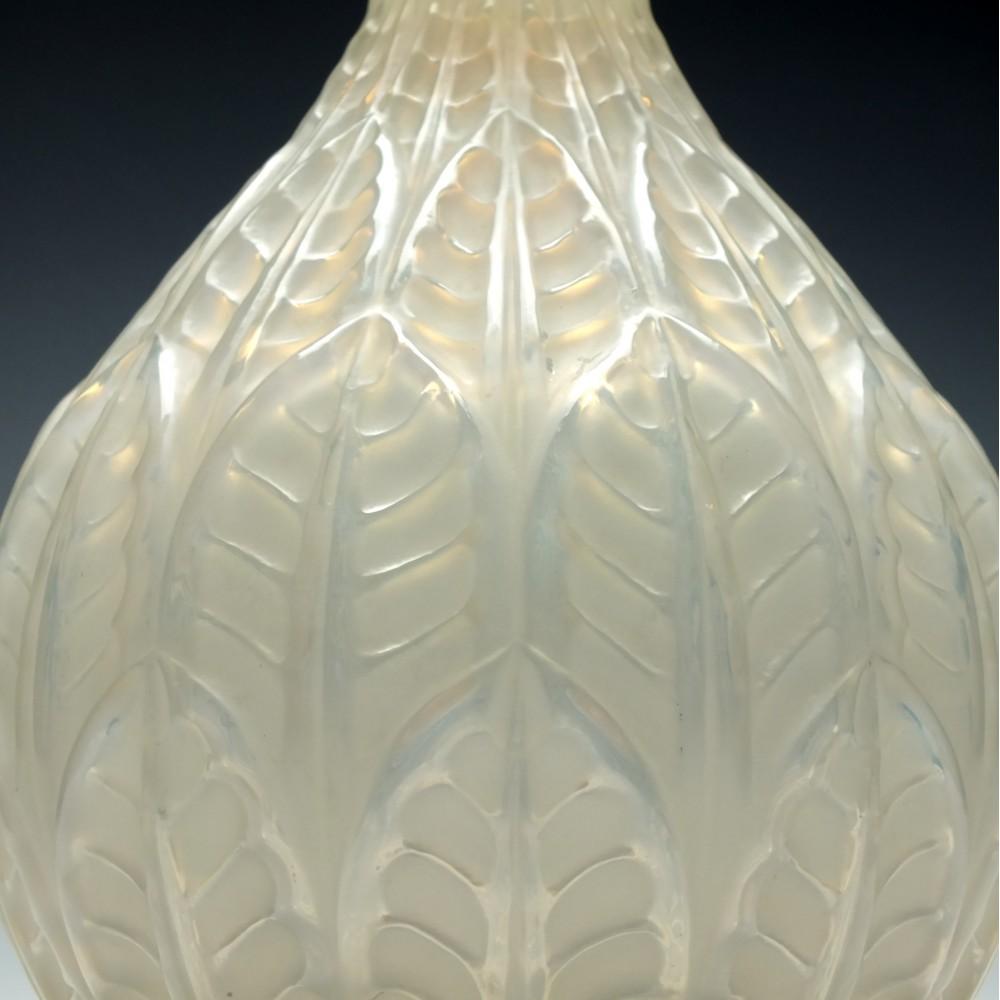 René Lalique opalescent Malesherbes vase Marcilhac no. 1014

Engraved R Lalique, France N°1014 on the base,

circa 1927.