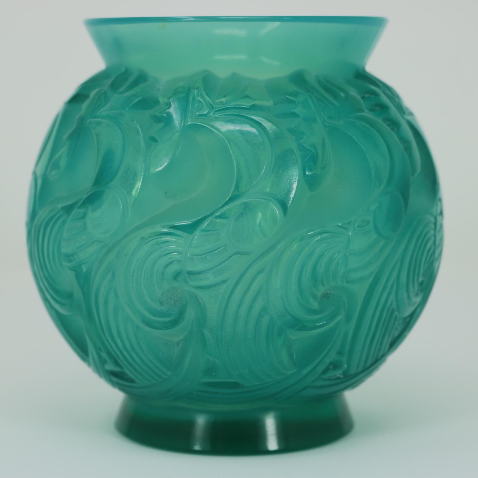 Rene Lalique mint coloured and opalescent glass 'Le Mans' vase. This pattern features crowing cockerels/roosters around the sides. Stenciled makers mark, 'R LALIQUE FRANCE' to the underside. Book reference: Marcilhac 1074.