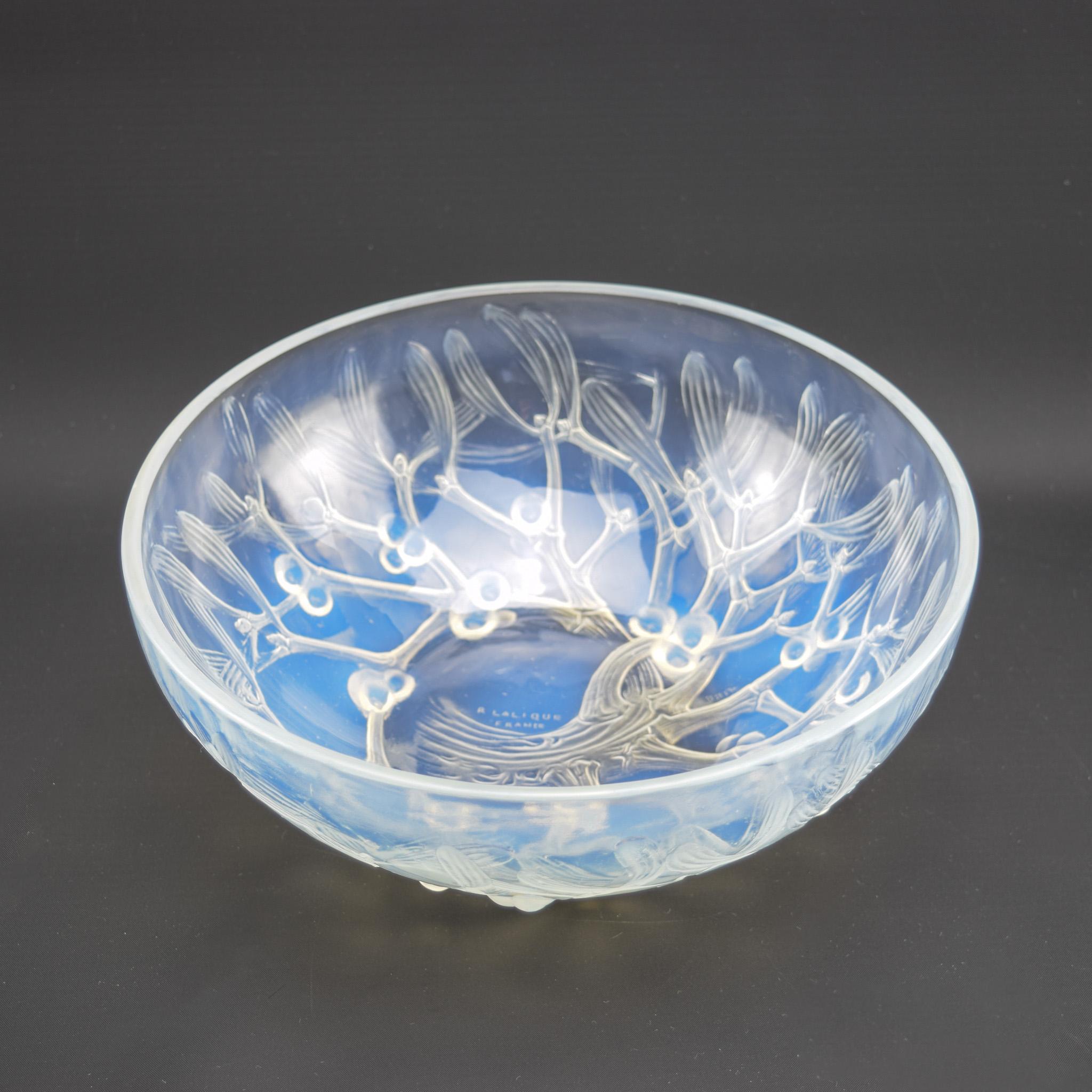 Rene Lalique opalescent Gui bowl No1
Moulded with mistletoe and having very nice opalescence 
There were 2 sizes of the Gui bowl made this is the largest of the 2 
Engraved  mark to the centre of the bowl R Lalique France
The condition is very good,