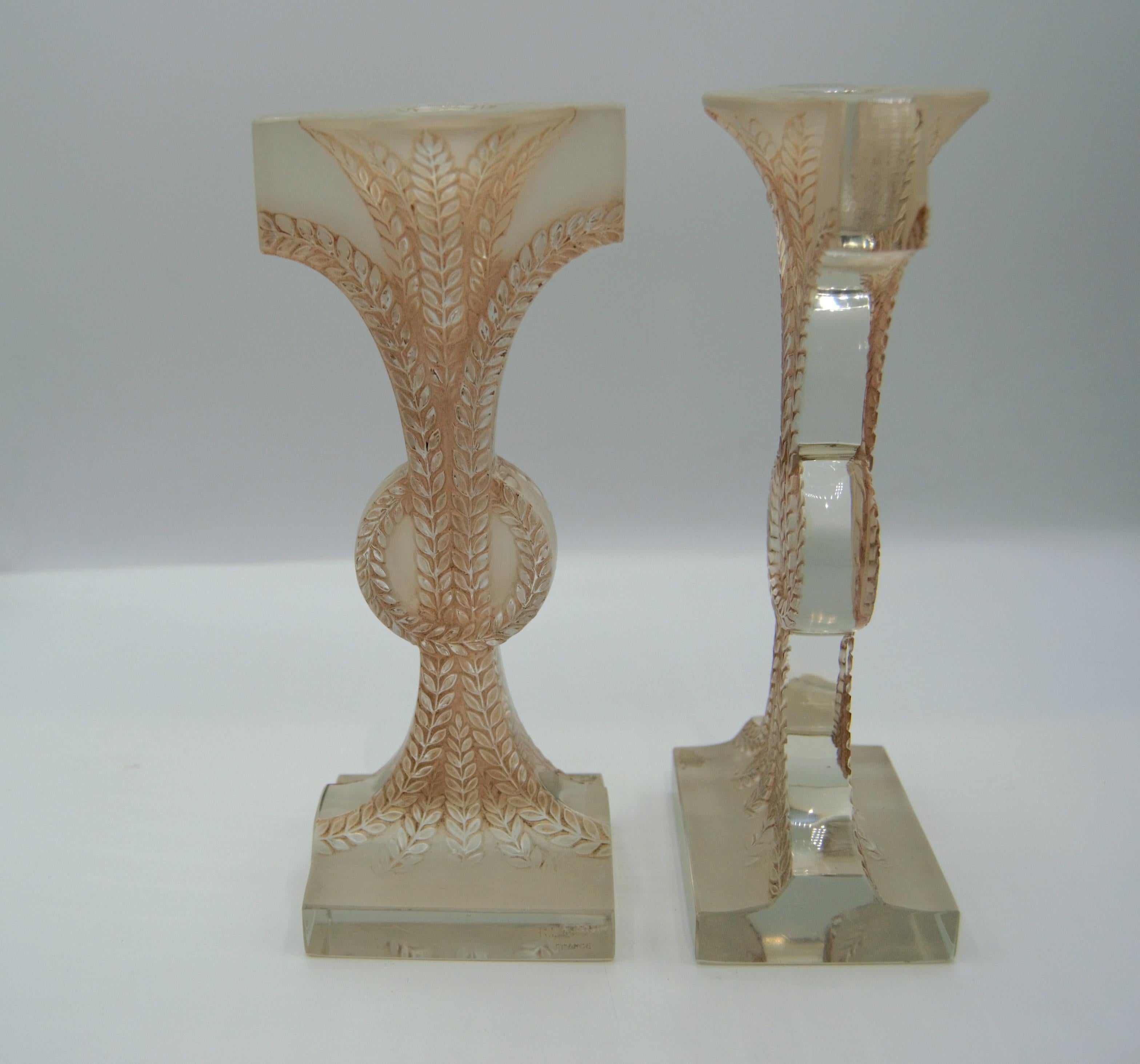 A pair of blown-molded glass candlesticks by René Lalique model 