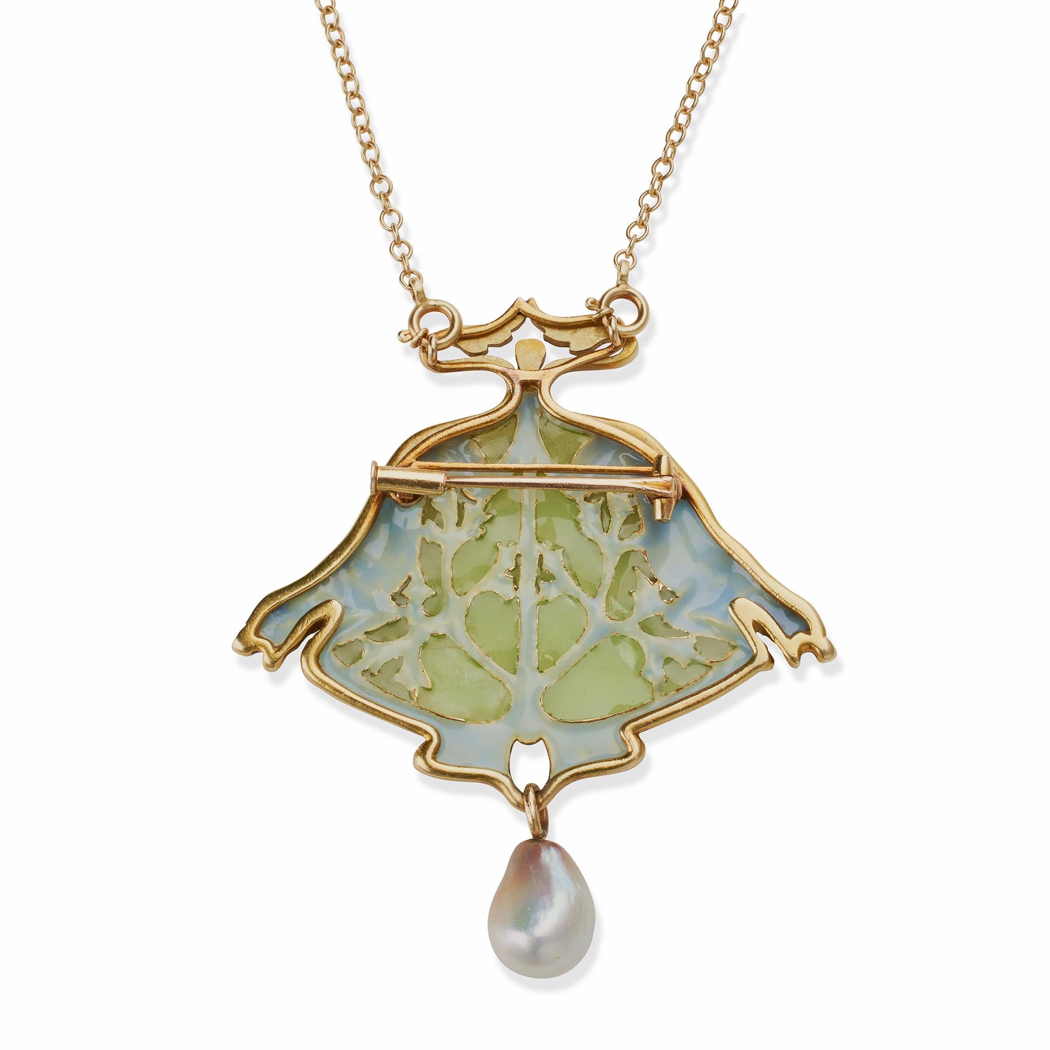 Likely created circa 1903-1907, this plique-à-jour enamel and natural pearl pendant brooch with chain by René Lalique is set in 18K gold. The modified triangular form, composed of chased 18K gold, centers two stalks of seaweed among pale green