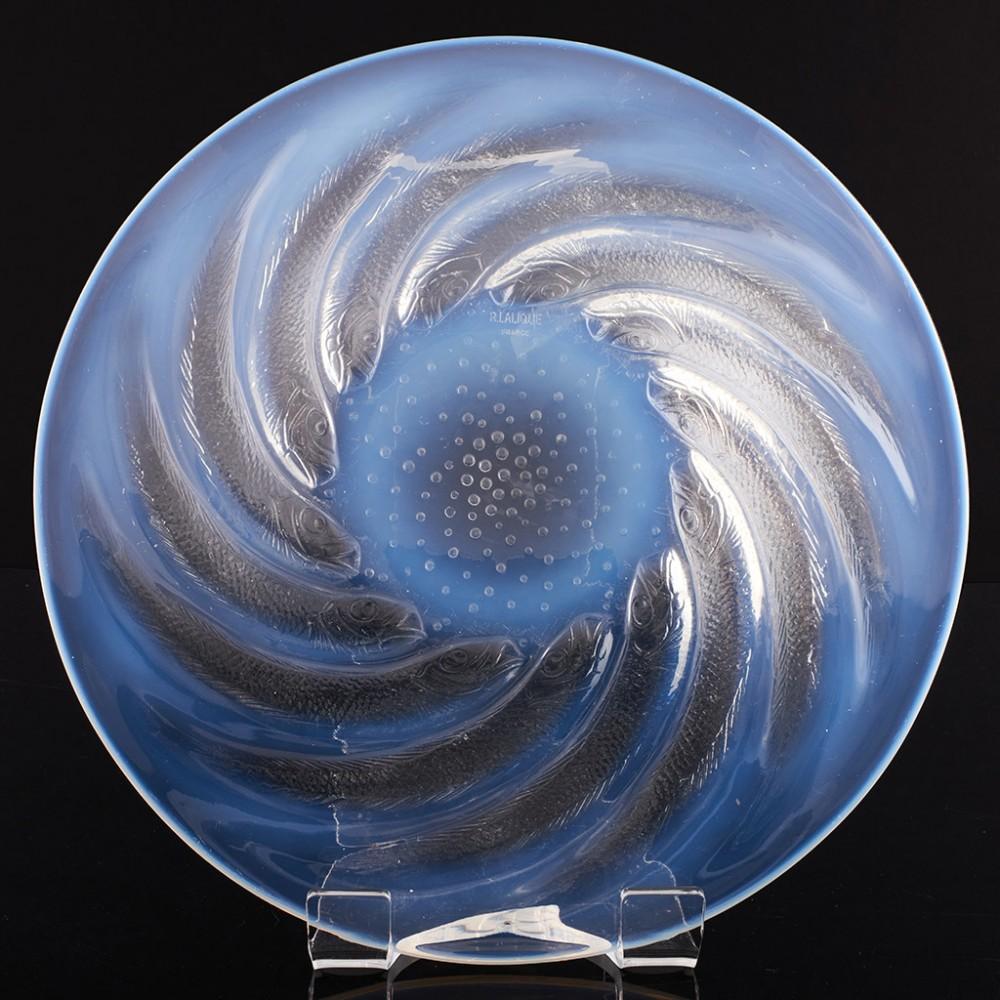 Heading : A  Rene lalique poissons coupe plate Marcilhac 3263
Date : Designed 1931
Origin : Alsace, France
Colour : Opalescent
Bowl : Controlled spiral bubble pattern at the centre. Stencil R LALIQUE mark
Glass Type : Lalique demi-cristal
Size :