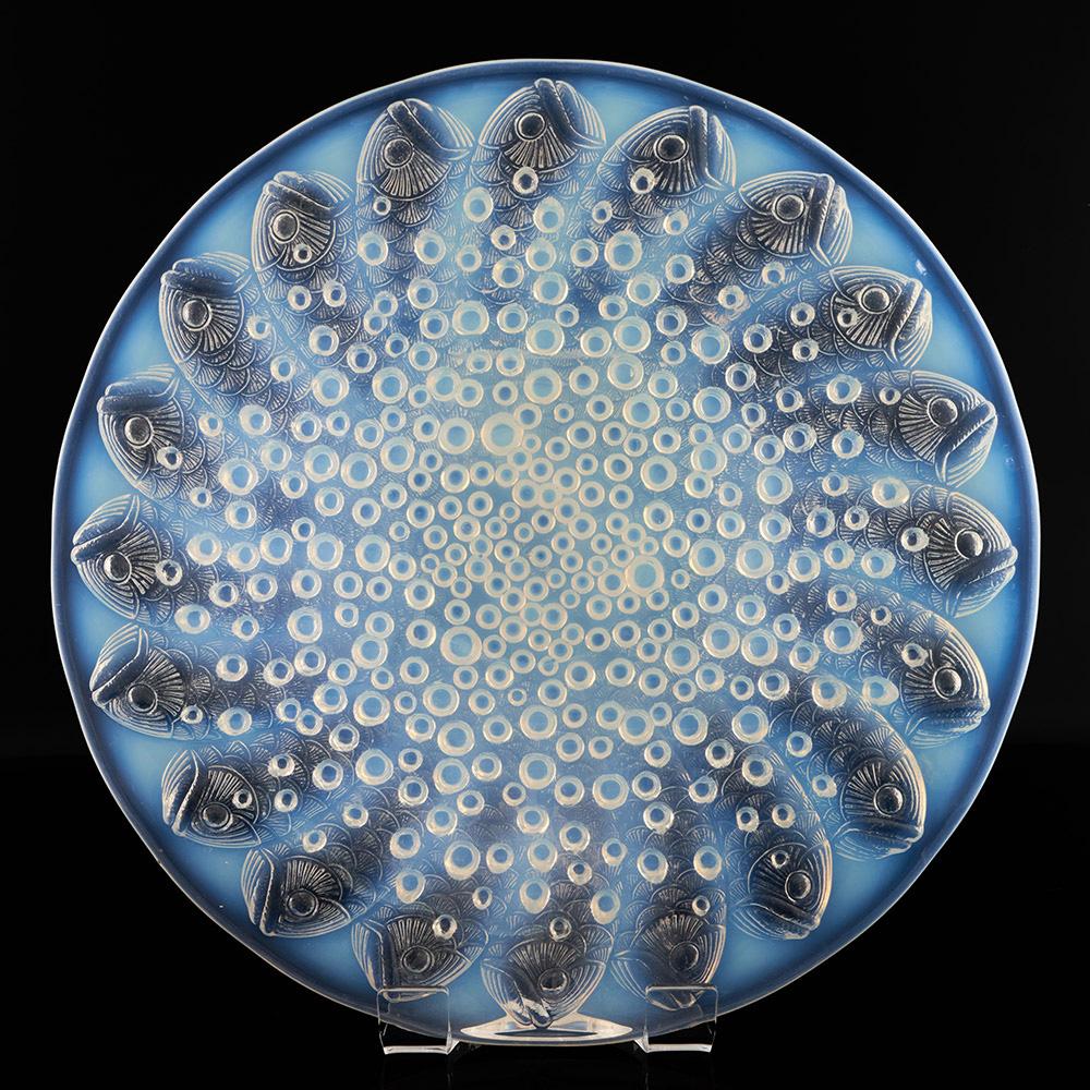Heading : Rene Lalique Roscoff coupe
Date : Designed 1932. Marcilhac 10-383
Origin : Wingen-sur-Moder. France
Bowl Features : Moulded fish design with bubbles – opalsecent and clear glass
Marks : R LALIQUE FRANCE acid etched
Type : Lalique