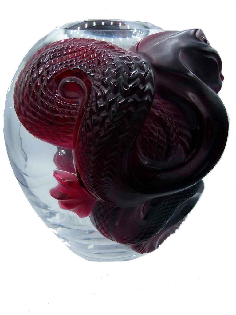 René Lalique ruby dragon glass vase

Swollen clear glass body with two applied ruby glass dragons, Lalique in script on base and numbered 6/99.