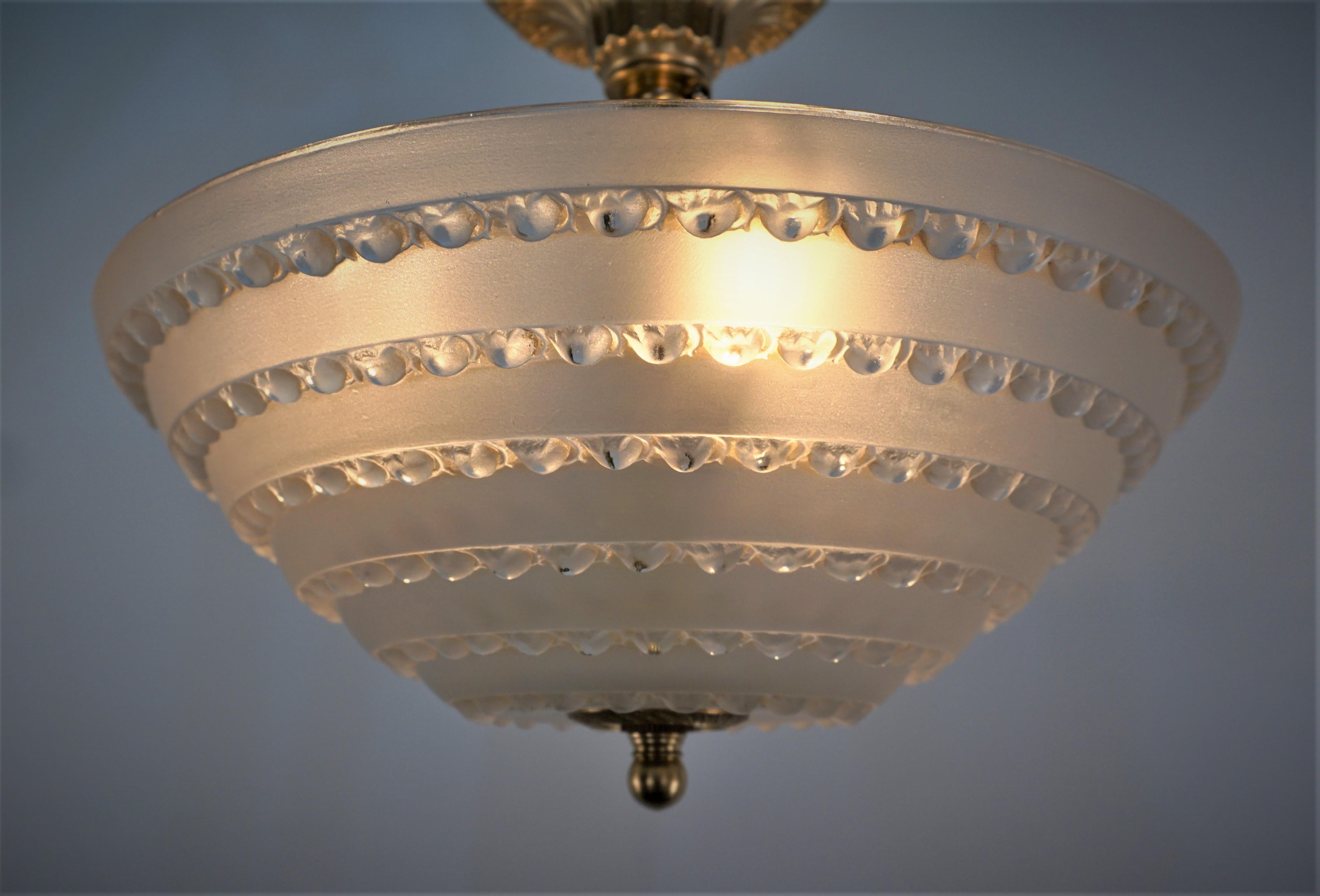 French 1920's Rene Lalique art deco semi flush mount clear frost glass with very light touch of brown and bronze hardware.
Professionally rewired with 3 lights and ready for installation. 