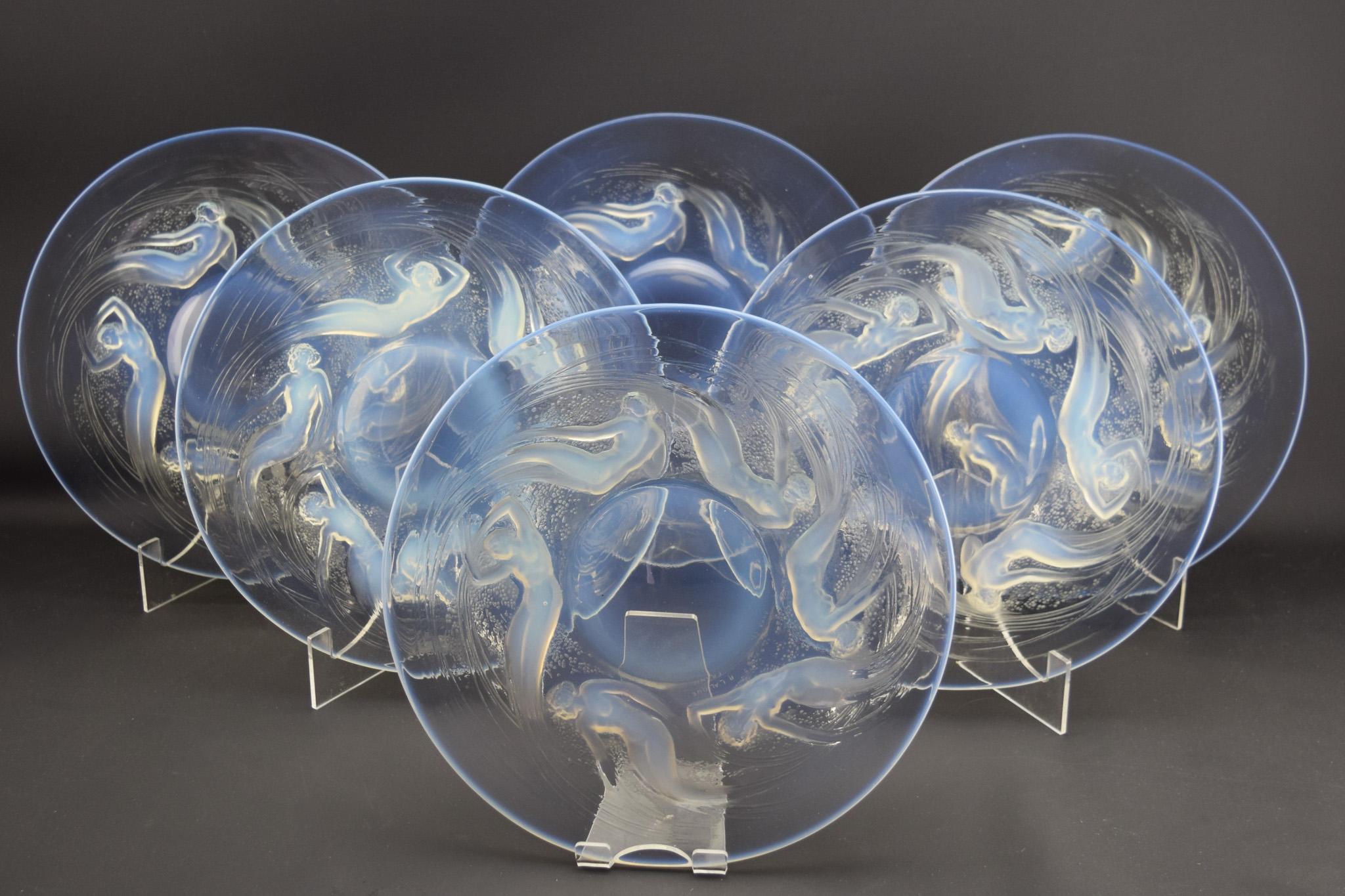 Amazing set of six Rene Lalique Art Deco Ondines glass plates C1921
Finding a set of these plates is incredibly rare and seldom seen.
Each have a nice strength of opalescence and are in very good condition.
They are all marked, 5 have wheel cut R