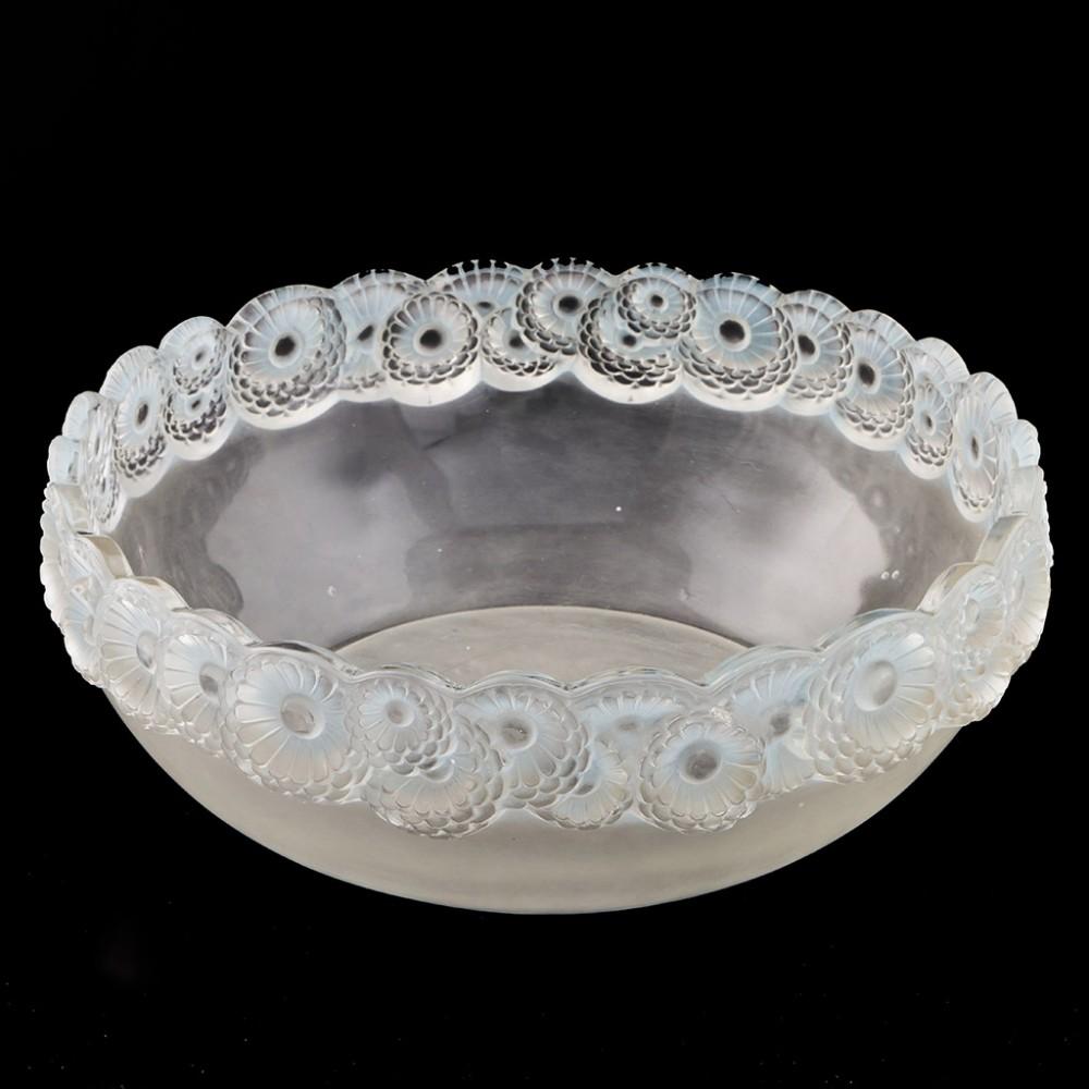 An Art Deco Rene Lalique designed 'Soucis' bowl from Lalique's Wingen-sur-Moder studio. The bowl features patinated pale blue glass with a rim made from a ring of field marigold or calendula flowers. The piece is acid stencil marked R Lalique.