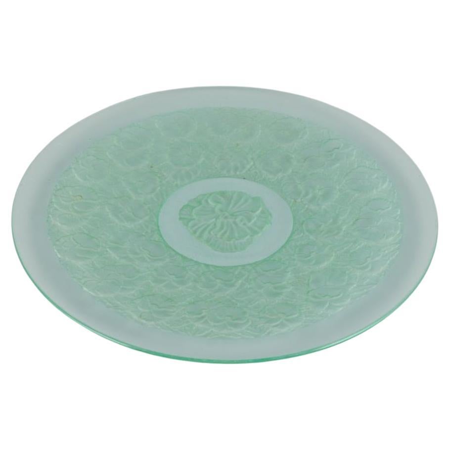 René Lalique style. Colossal bowl designed with flower motifs in green art glass For Sale