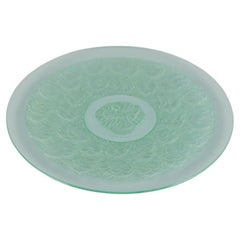 René Lalique style. Colossal bowl designed with flower motifs in green art glass