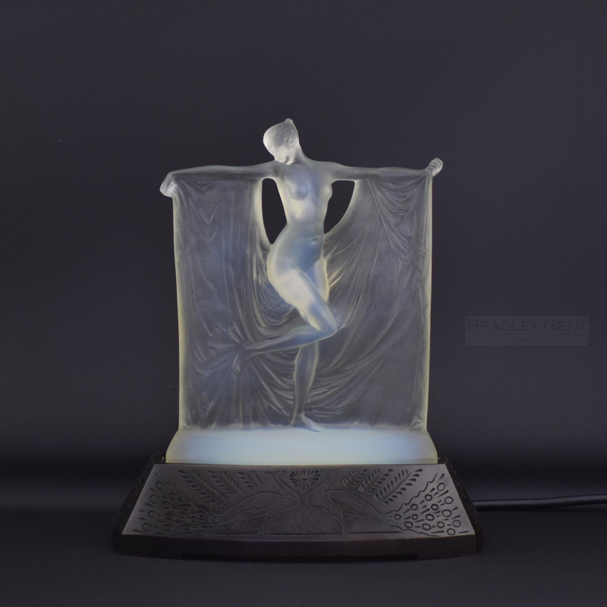 Rene Lalique Suzanne opalescent glass statuette. Suzanne is one of Rene Lalique's most iconic pieces and has probably featured on the cover of more Lalique books than any other piece.
Engraved to the base R Lalique France along with the model number