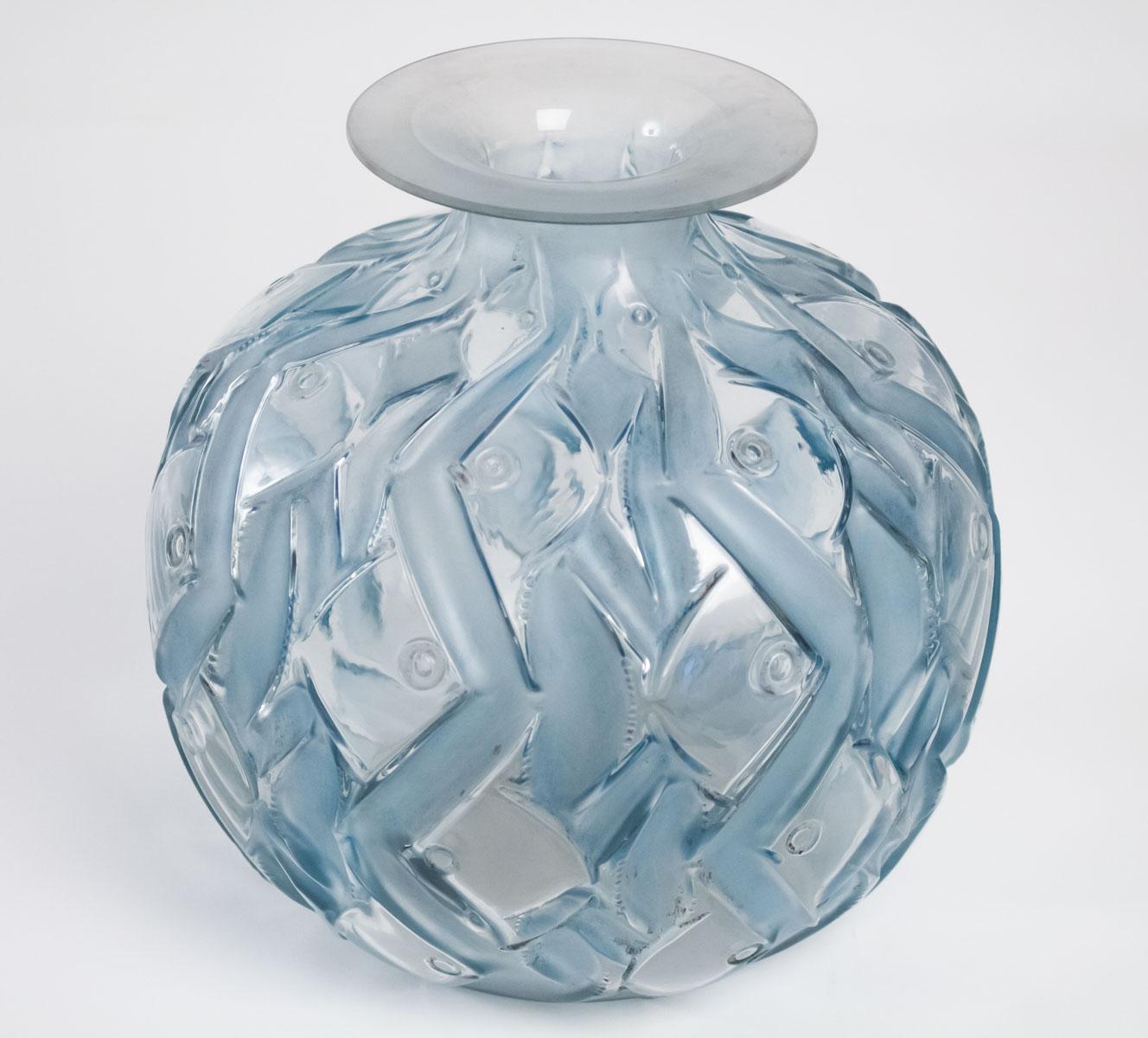 Artistic small fish in a geometric wavy pattern simulating water, 
circa 1928, France, model introduced 1928
Highlighted with a blue stain .
Marcilhac no. 1011, 

Penthièvre vase or