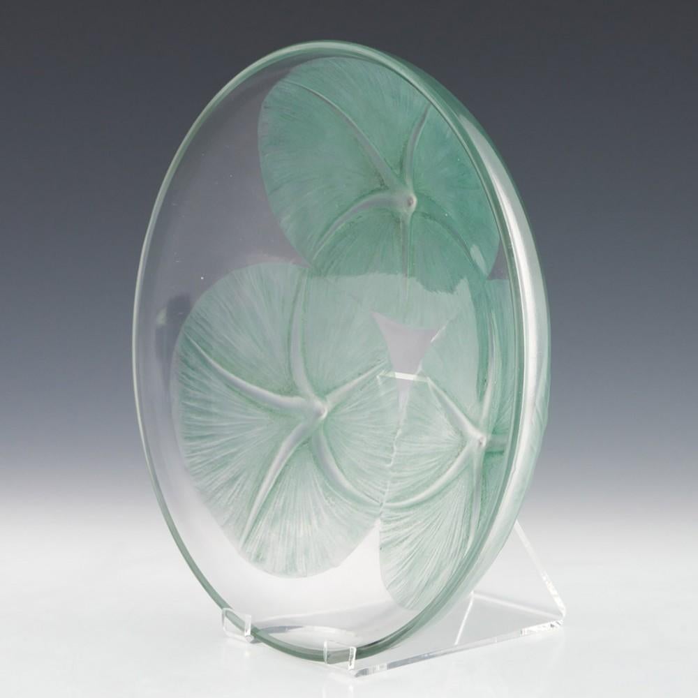 Heading : Rene Lalique coupe volubilis
Date : c1921
Origin : Wingen-sur-Moder, France 
Bowl Features : Sage green stained and frosted volubilis ipomoea (common morning glory) on a clear ground
Marks : Very small R Lalique 
Type : Lalique