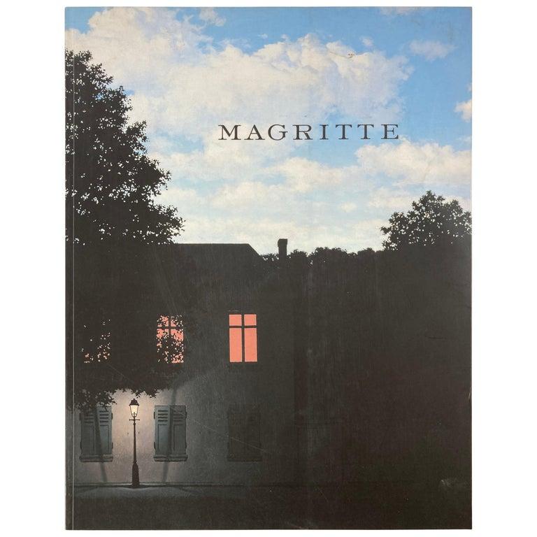 Rene Magritte by Siegfried Gohr coffee table book.
The enigmatic images of the great Surrealist Rene Magritte (1898-1967) are so powerful that they seem to define a completely new reality, where everyday objects and familiar situations are