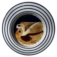 Rene Magritte ceramic decorative plate , marked edition with original box .