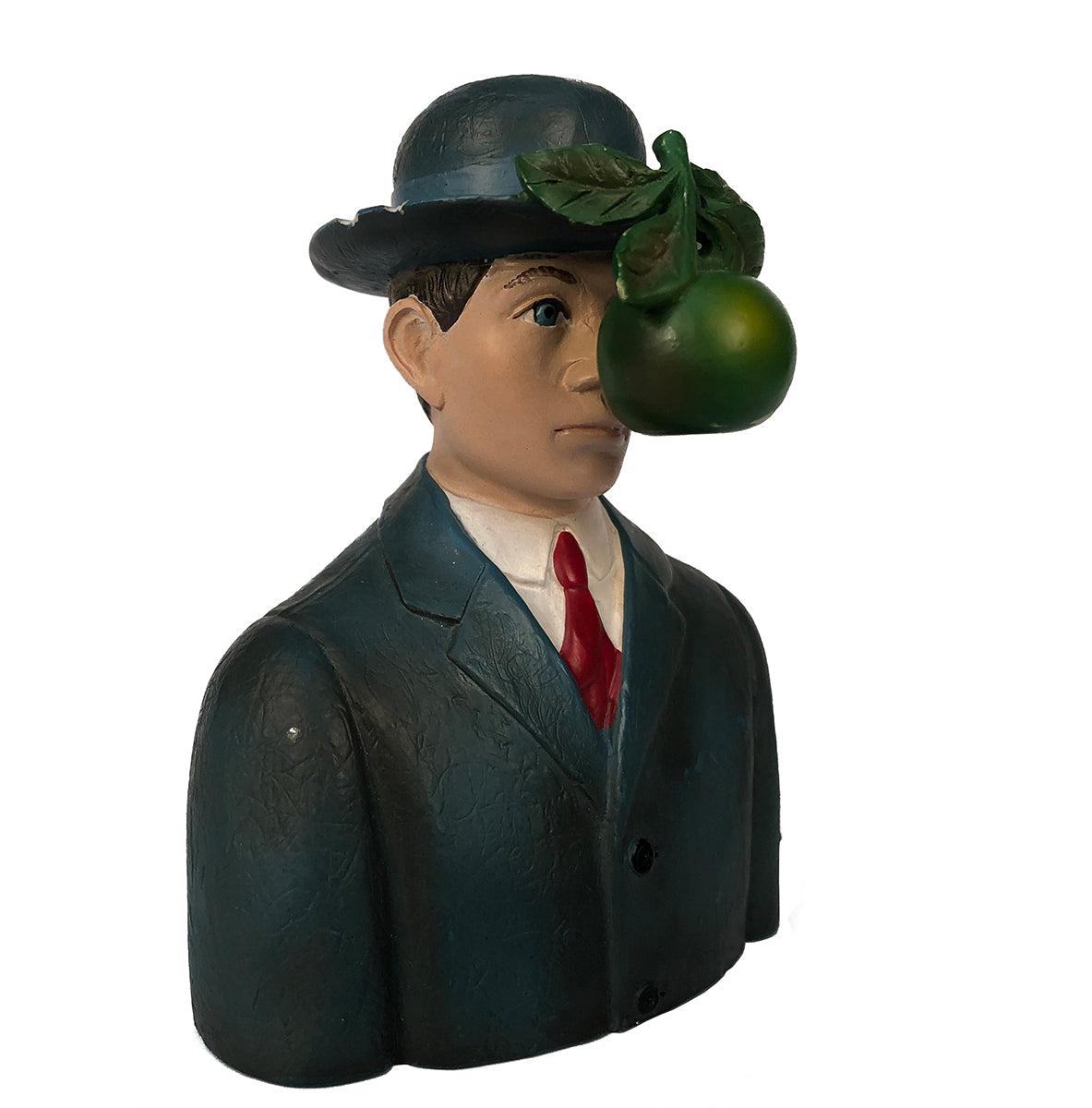 This finely crafted miniature resin sculpture replicates René Magritte’s iconic Le Fils de l’Homme, capturing the artist’s enigmatic vision in exquisite detail. Measuring 3.75 x 3 x 2 inches and weighing approximately 1 lb, this small-scale piece