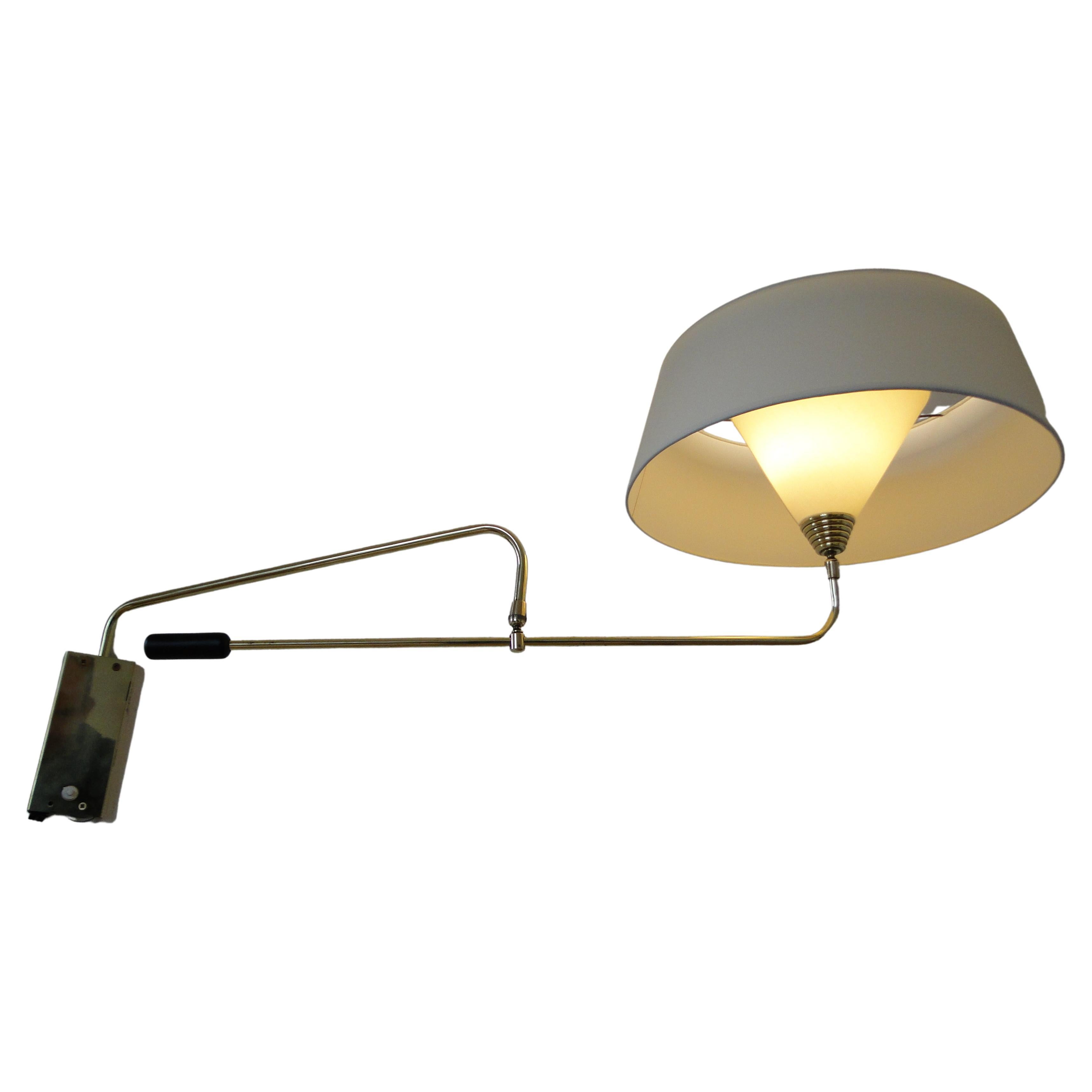 Large wall lamp with counterweight from Maison Arlus, France 60s.

Triple movement, head on ball joint with orientation rod, position of the main arm adjustable by a 
