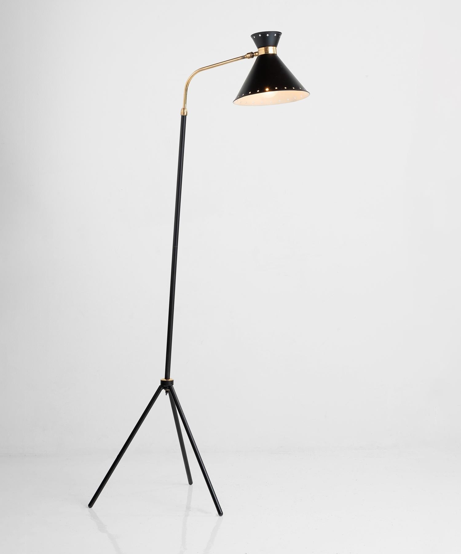 Rene Mathieu floor lamp, France circa 1950.

Black tripod base with brass plated metal neck and perforated black shade. Produced by Lunel.
