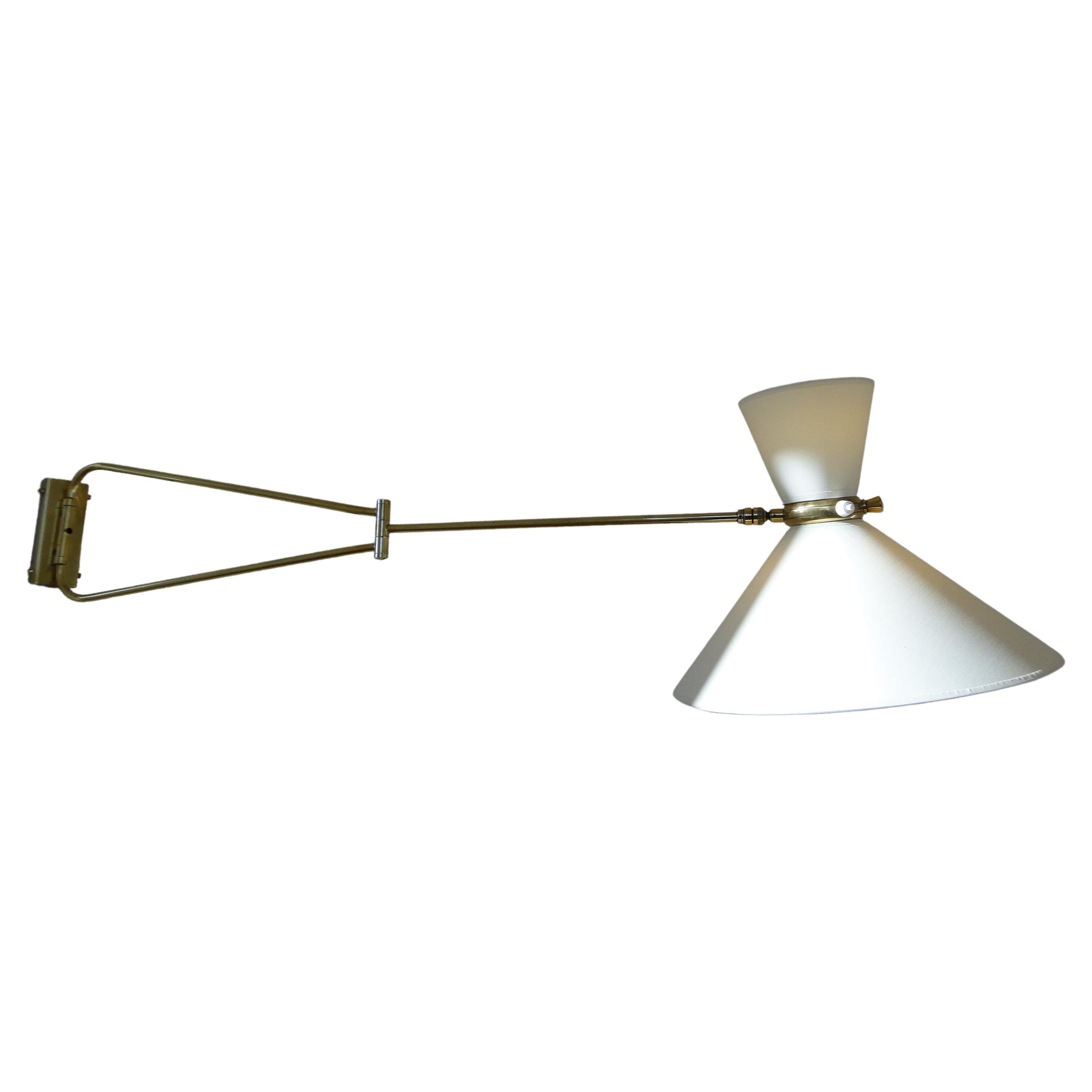 Vintage very large wall lamp by René Mathieu 1950 France.

Wall light by René Mathieu from the 1950s.

2-Arm articulated  brass stem.

The double bulb sconce has independent switches for the up and down lights. 

New diabolo lampshade.

36 cm in and