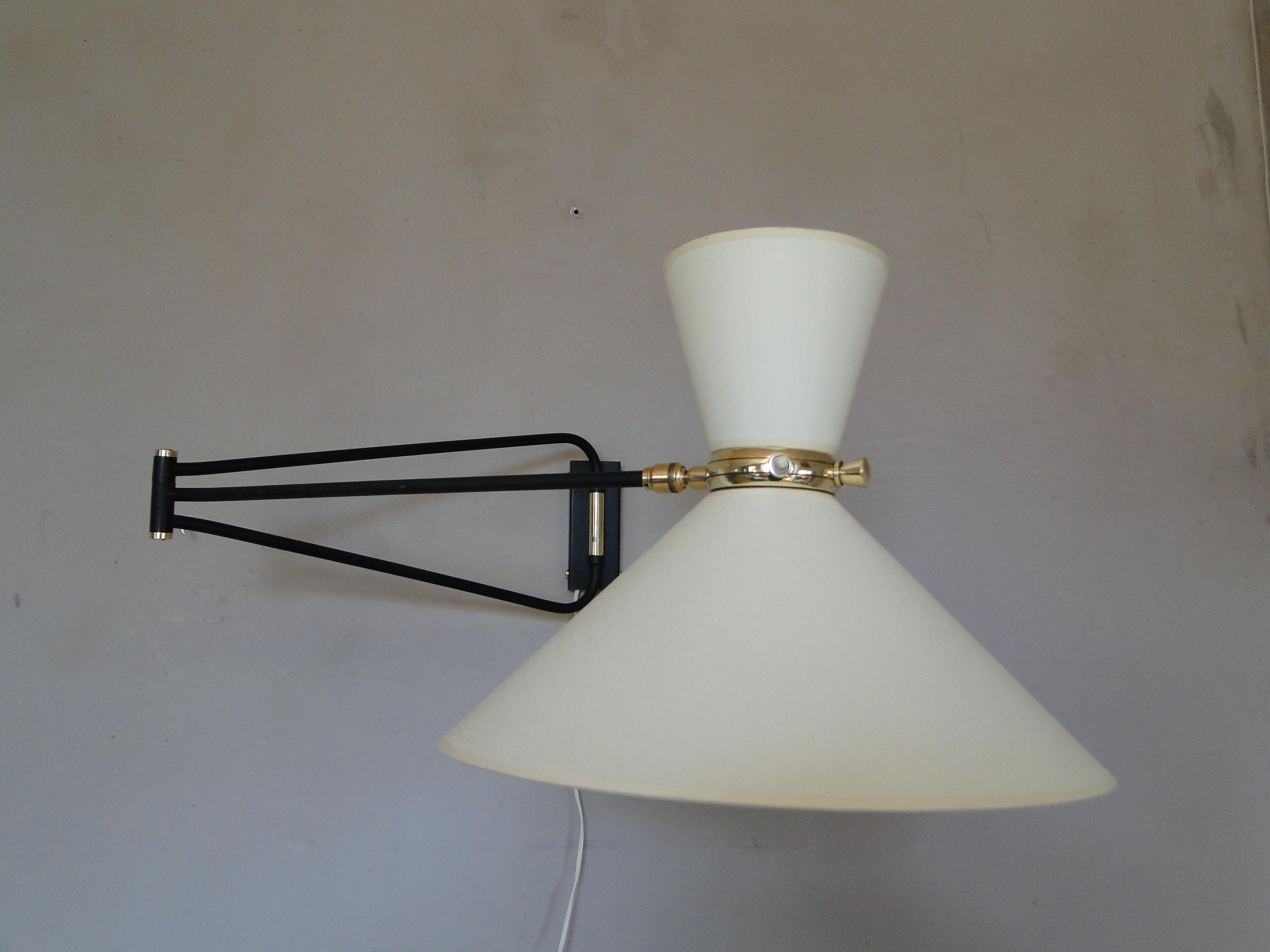 Vintage very large wall lamp by René Mathieu 1950 France.

Wall light by René Mathieu from the 1950s.

2-Arm articulated brass stem.

The double bulb sconce has independent switches for the up and down lights. 

New diabolo lampshade.

36 cm in and