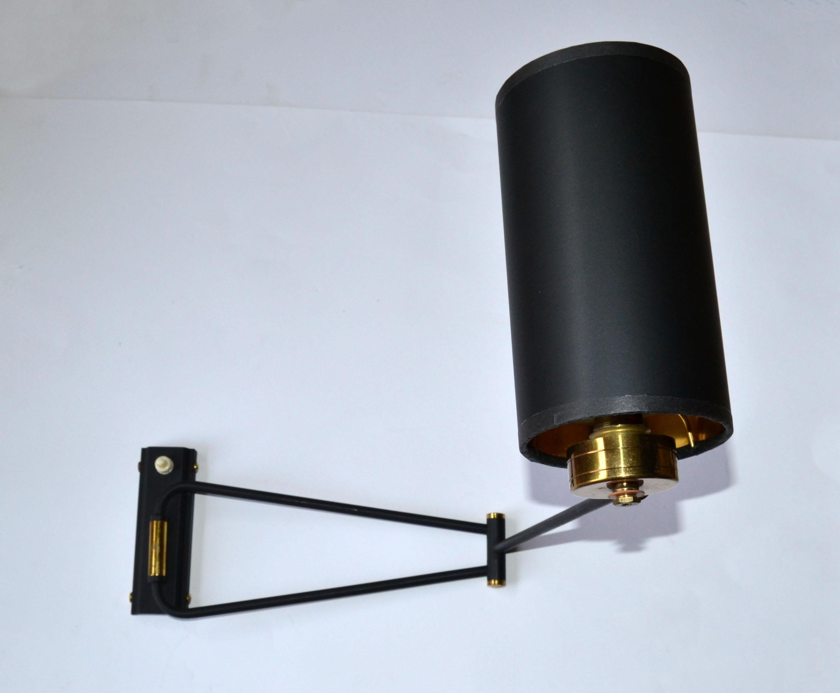 Superb Brass & black finished Steel double arm swing arm sconce with push on switch by Rene Mathieu, adjustable sconce made in France.
US rewired and in working condition, takes 1 light, 60 watts max bulb.
Custom back-plate available. 
Shades