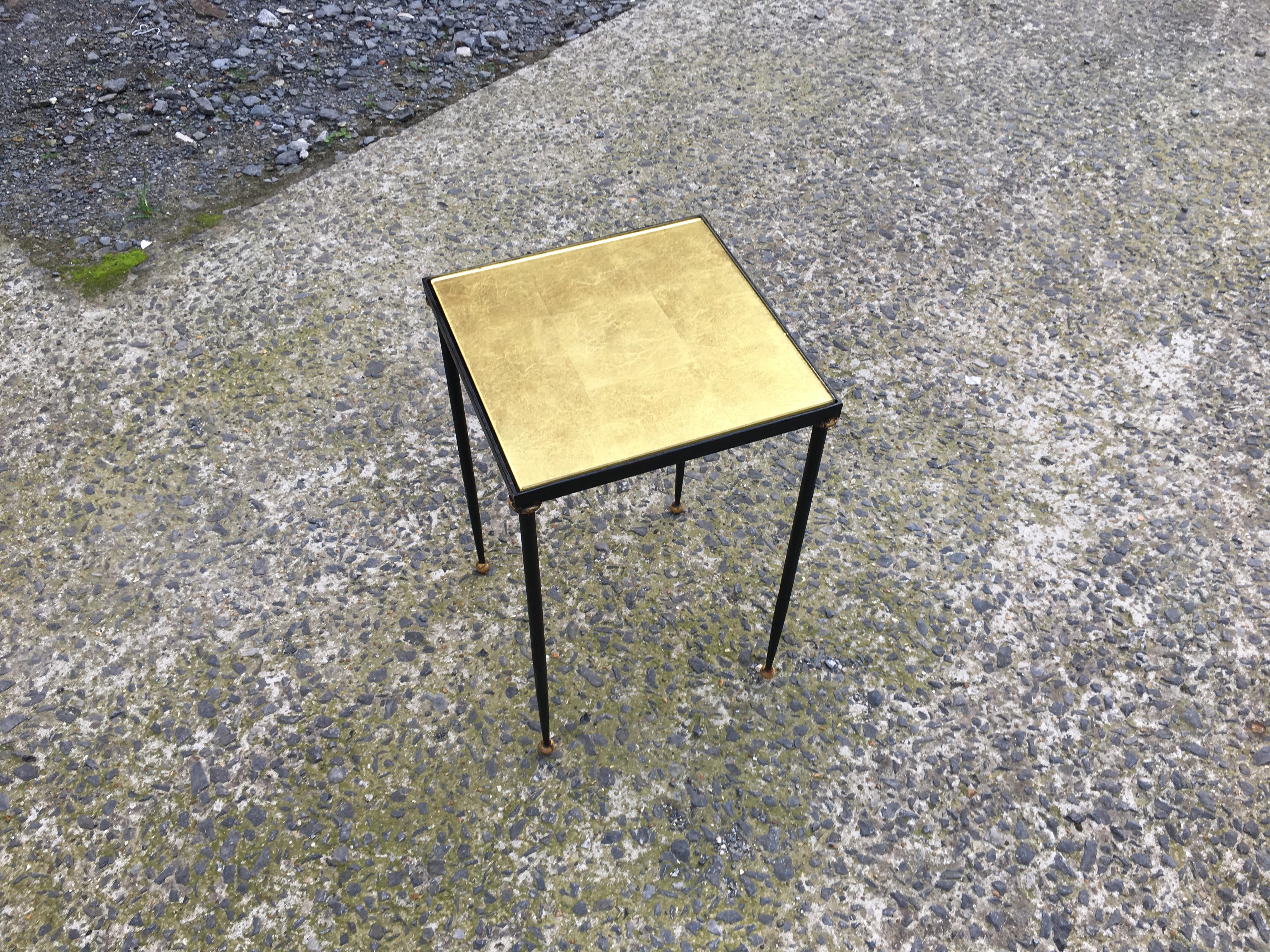 René Prou, elegant side table in lacquered and gilded metal, tray made of gold leaf under glass, circa 1940.