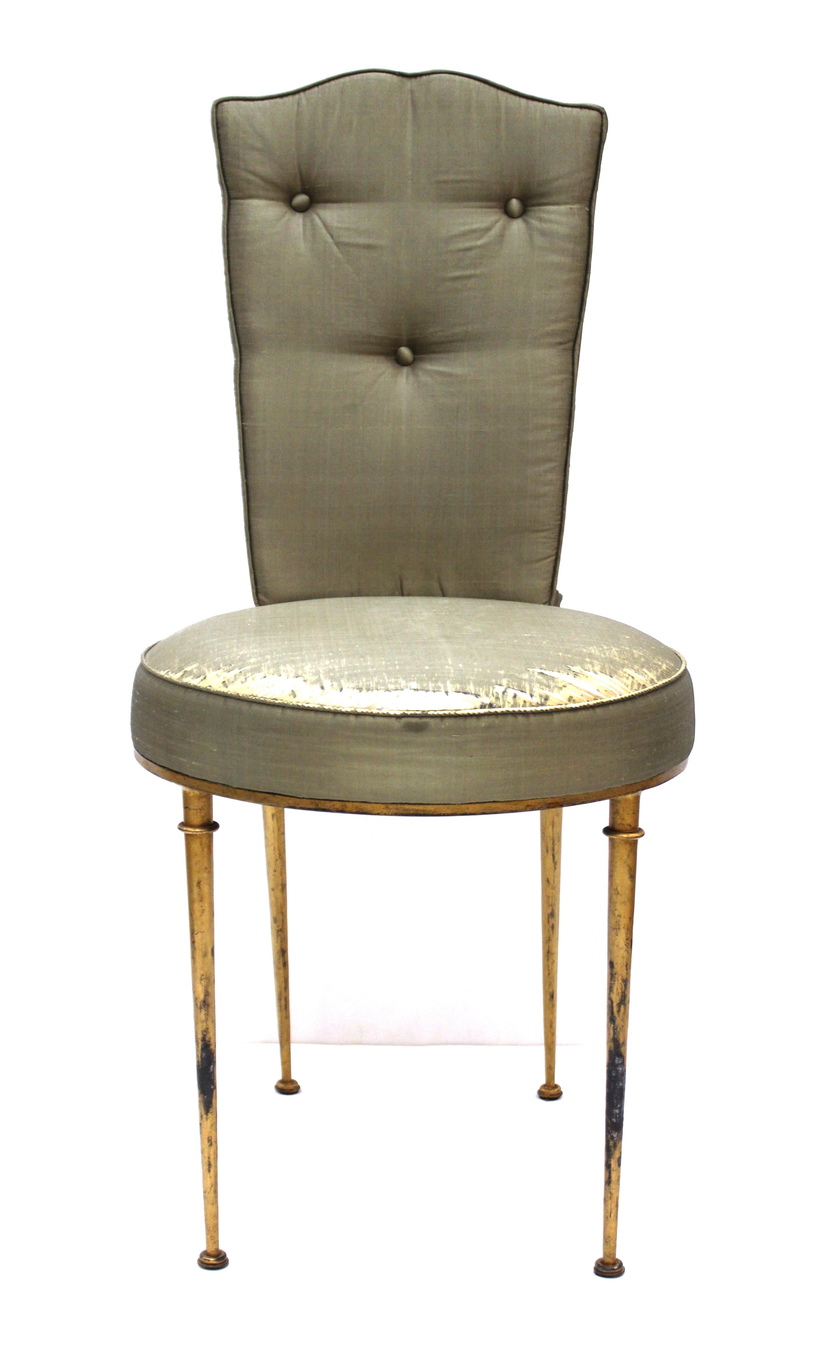 French Mid-Century Modern side chair or vanity chair in gilt metal, designed by Rene Prou. The piece was made during the mid-20th century and comes with the original upholstery. In great vintage condition with age-appropriate wear and use to the