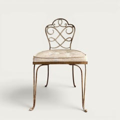 Silla de hierro forjado dorado y pintada de René Prou, década de 1930