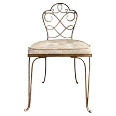 Silla de hierro forjado dorado y pintada de René Prou, década de 1930