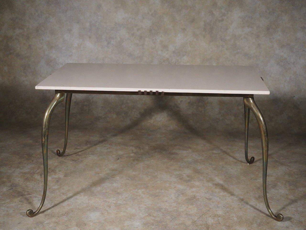 French Forties Art Deco low table by Rene Prou in bronze with original white glass top. Measures: 32” wide x 18” deep x 18” high.

René Prou

(1889-1948)

A decorator as well as furniture designer, Rene Prou was born in Nantes and educated in