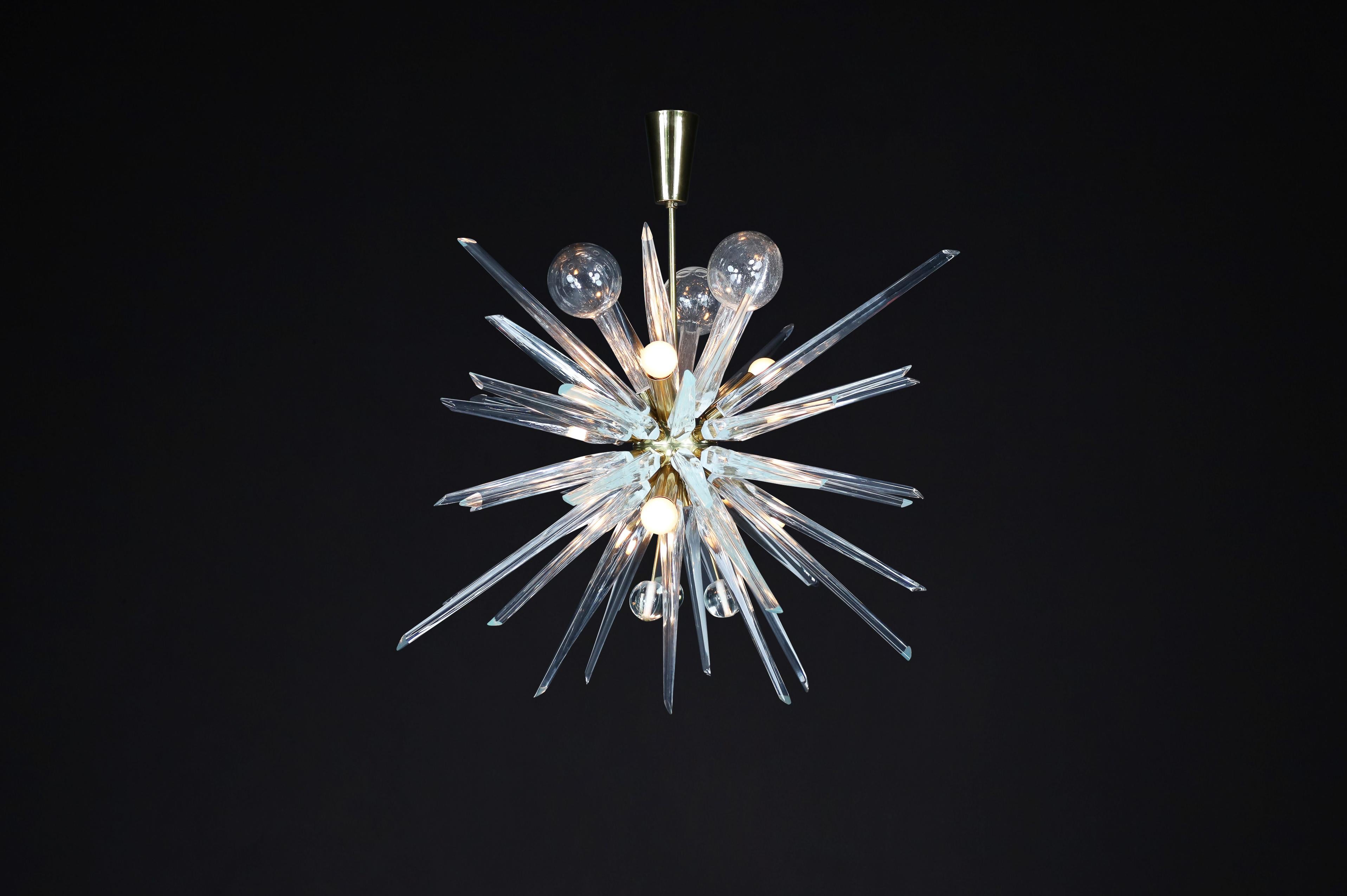 René Roubícek Brass Sputnik chandelier was Designed in the Czech Republic circa 1960.

Large brass sputnik chandelier designed by René Roubícek in the Czech Republic circa 1960. The chandelier's intense sculptural form resembles a flash and is