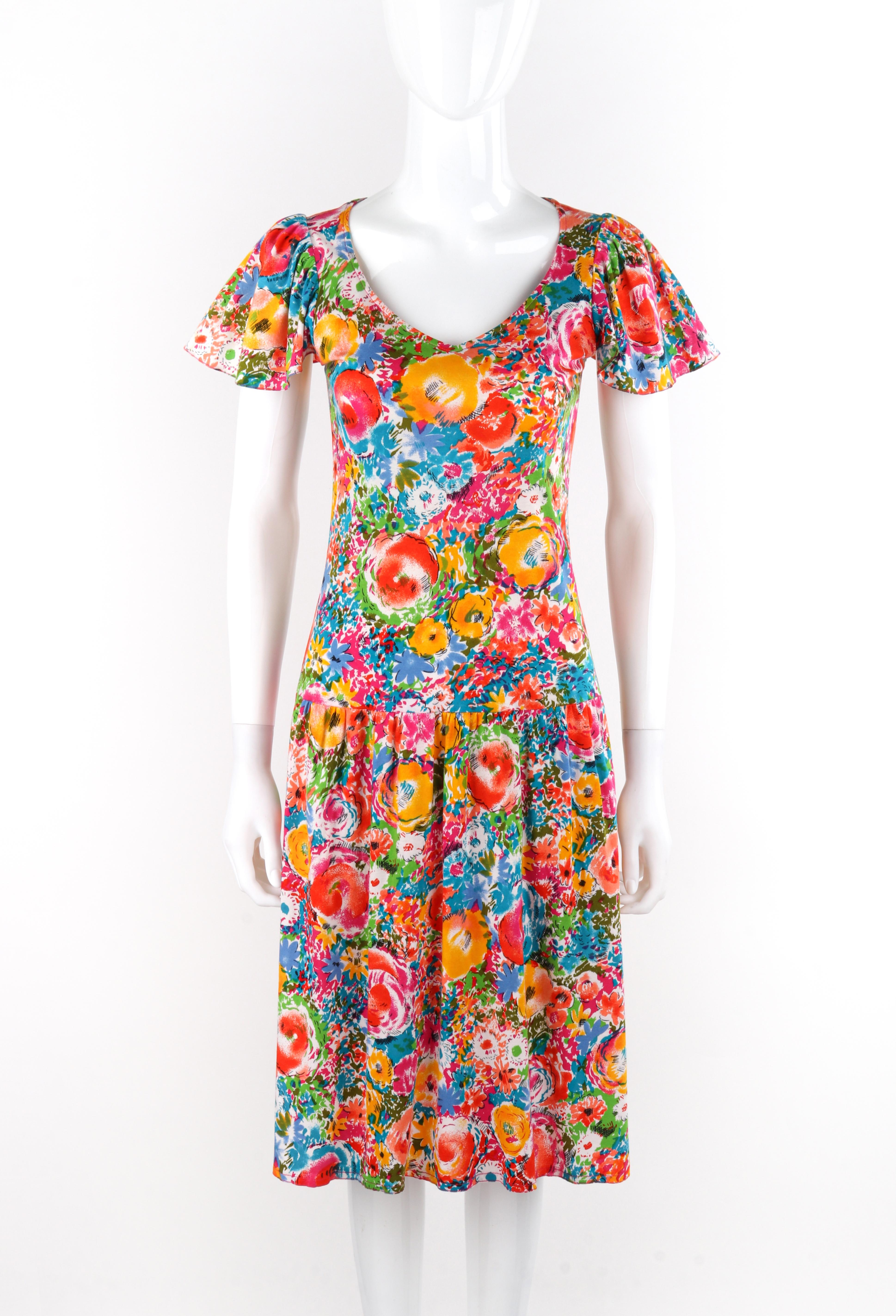 Brand / Manufacturer: Renee Helga Howie
Circa: 1980s 
Style: Drop waist knee-length dress
Color(s): Shades of black, white, red, orange, yellow, green, blue, purple, pink
Lined: No
Marked Fabric Content: 