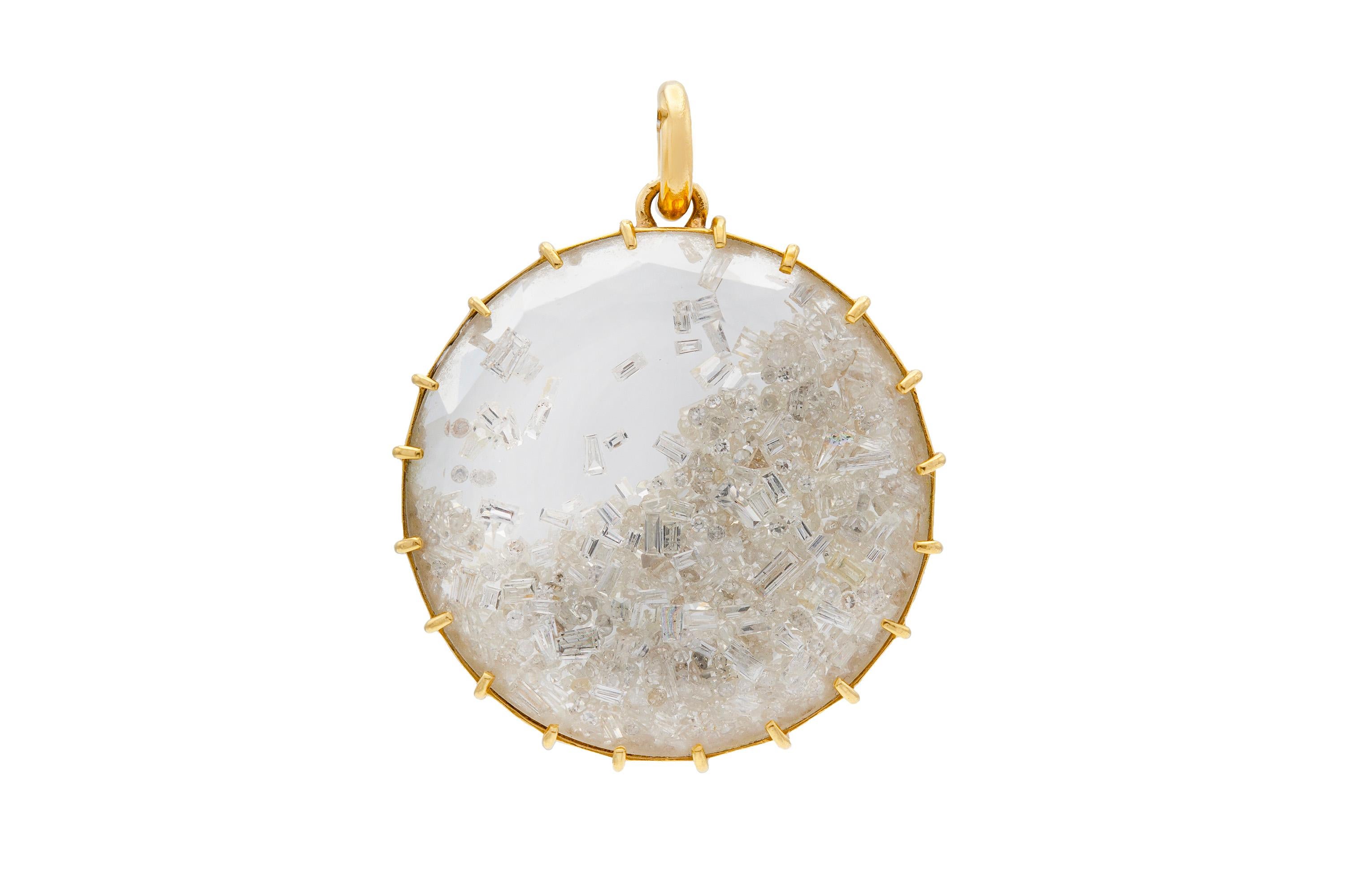 Circular pendant with loose diamonds inside weighing approximately 4.50 carats total, finely crafted in 18K yellow gold with original chain. From Renee Lewis' 