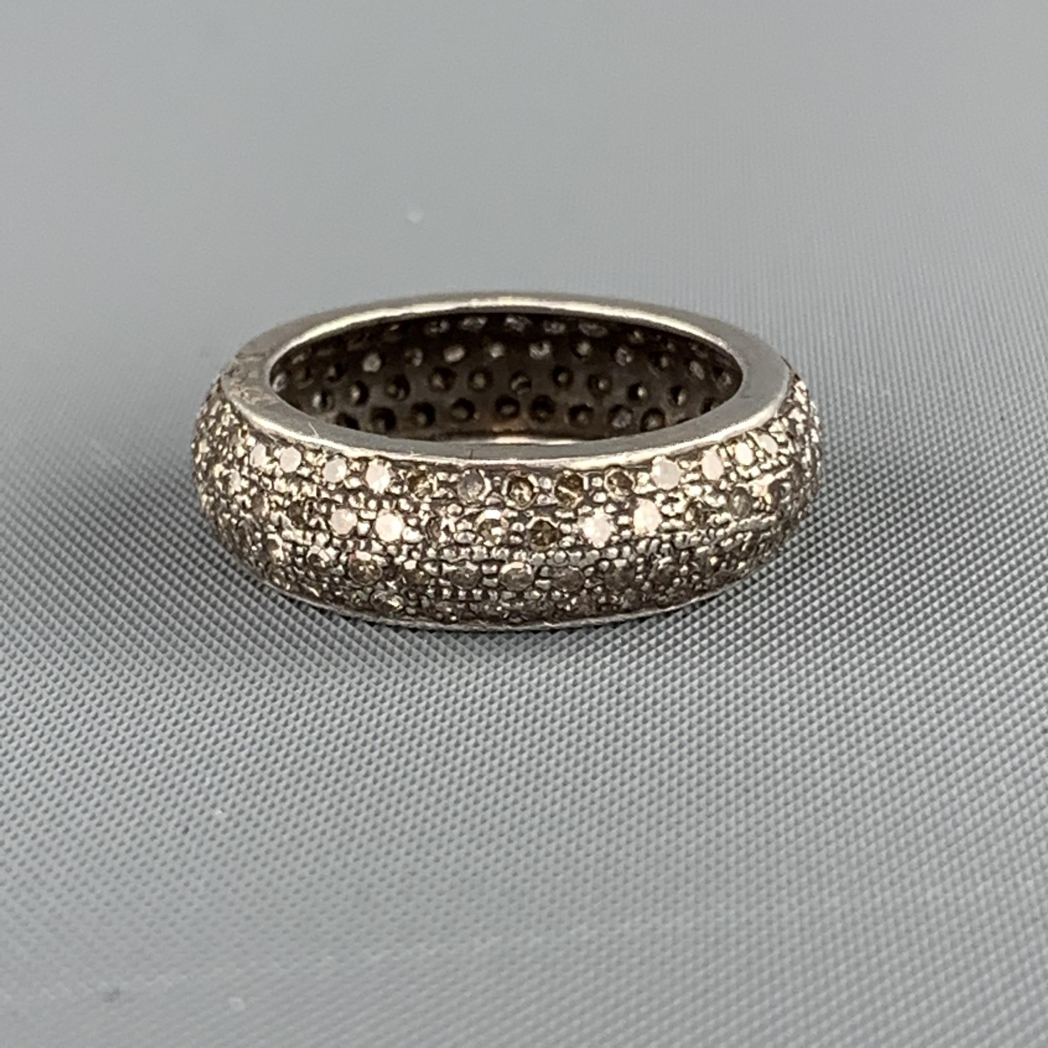 RENEE SHEPPARD band ring comes in a smoke tone Sterling Silver with an engraved texture encrusted with Pave diamonds throughout. 

Very Good Pre-Owned Condition.
Size: 6.5