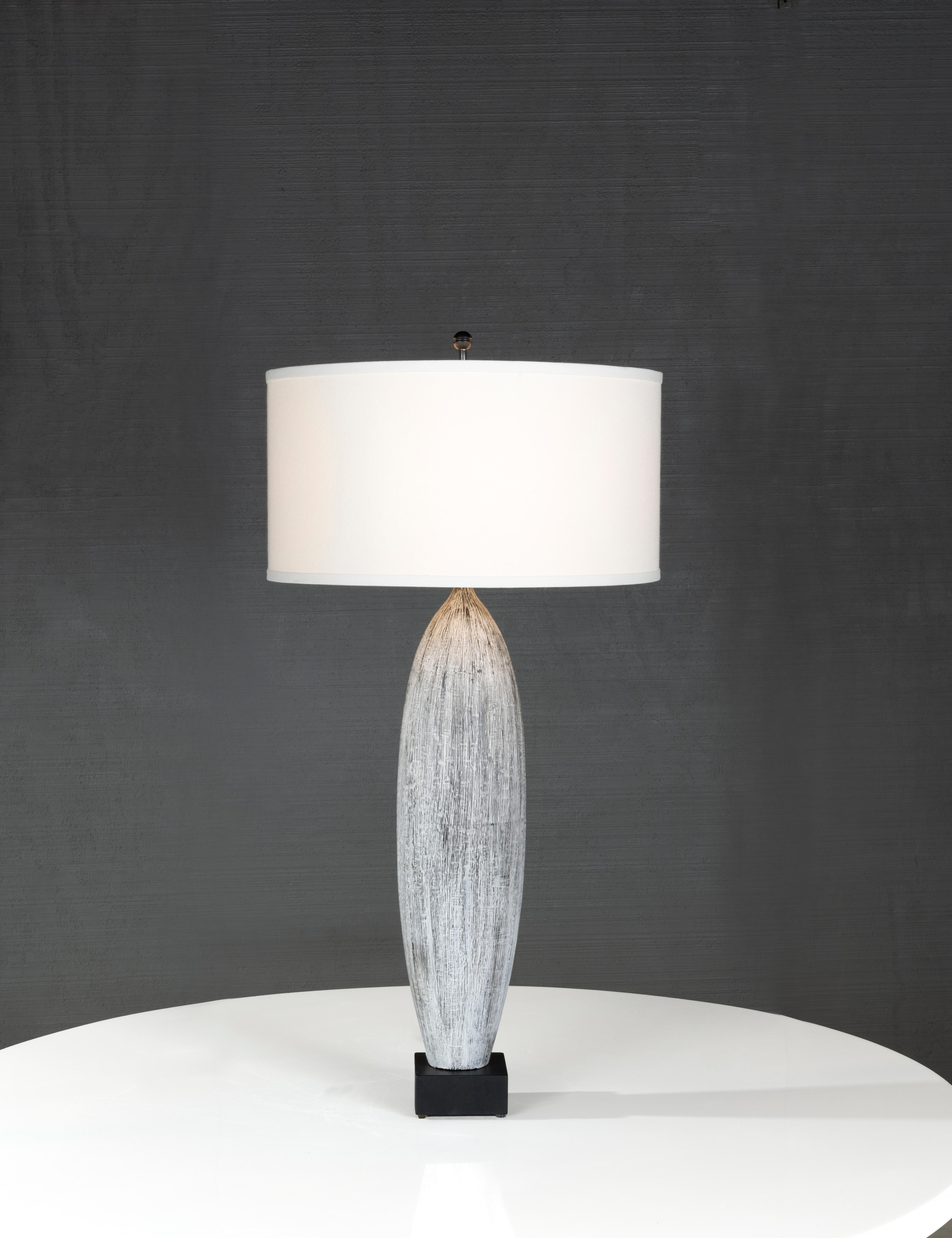 Part of our Reng lighting line. Beauty has always lived in the details, and this lamp is no exception. This ceramic table lamp is crafted with, Matte Glaze Ceramic, Bottle Jar Lamp with Japanese Ink Stick Decoration on Wood Mount. With an infinite