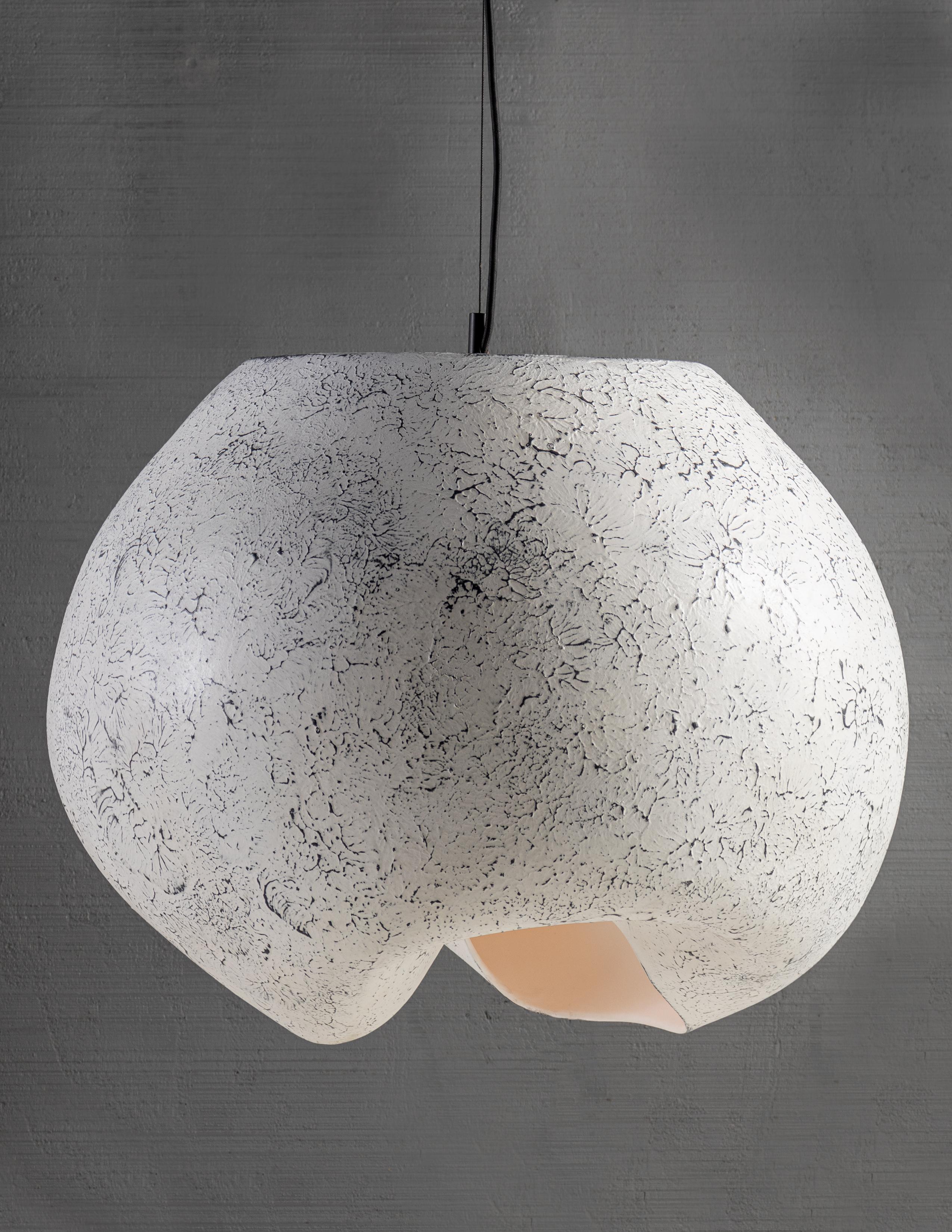 Hand formed ceramic

Bulb 1x medium base 100 watt incandescent.

The cloud pendant is formed from a large spherical mould then gently hand worked to create undulations implying motion levitation. Crafted by artisan in Northern Italy, Cloud reflects