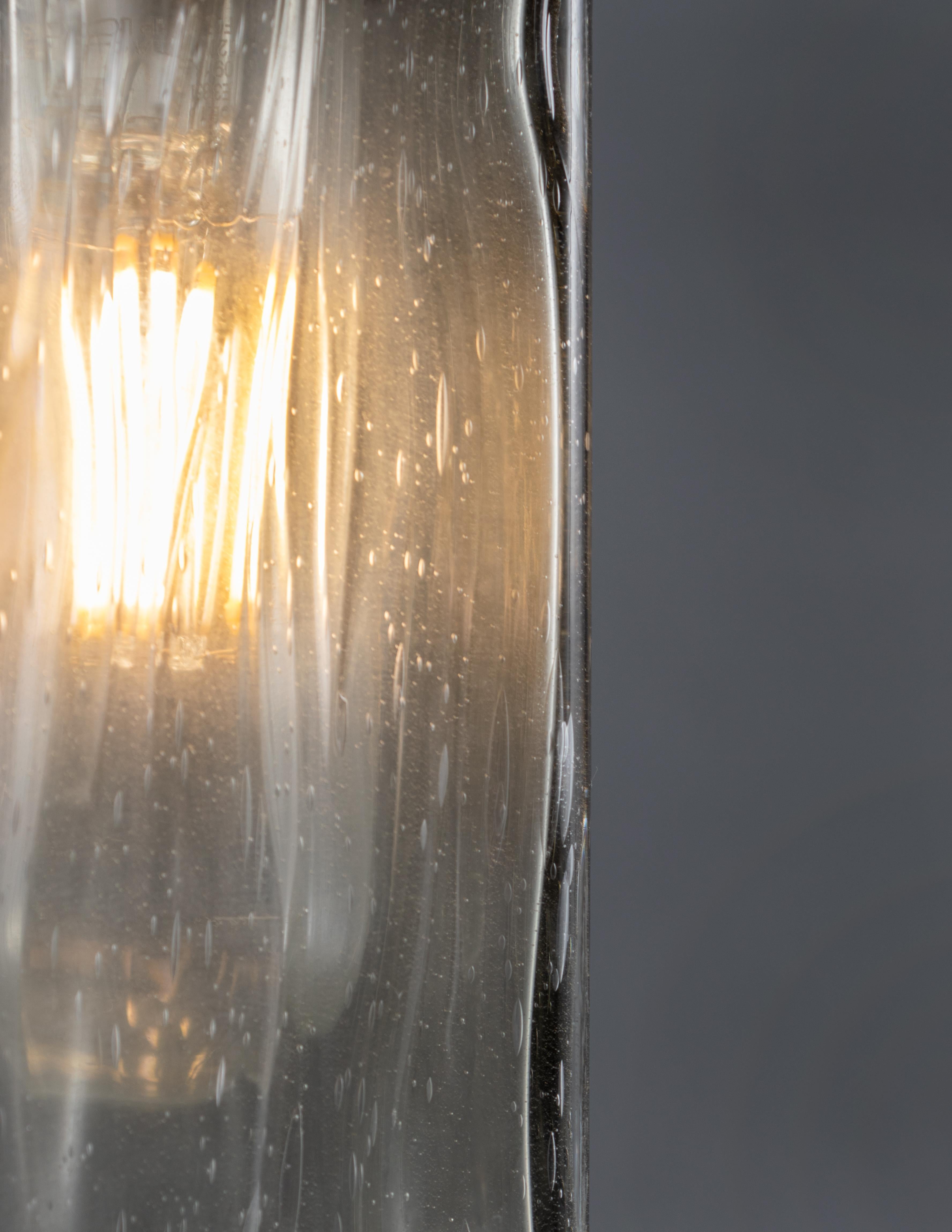 Artisanal cast and striated glass.
 
 Bulb 1 x medium base tubular LED.

Handcrafted by a small team of northern Italian artisans. Sold exclusively at Brendan Bass.

Minimum hanging height: N/A
Maximum hanging height: 70
