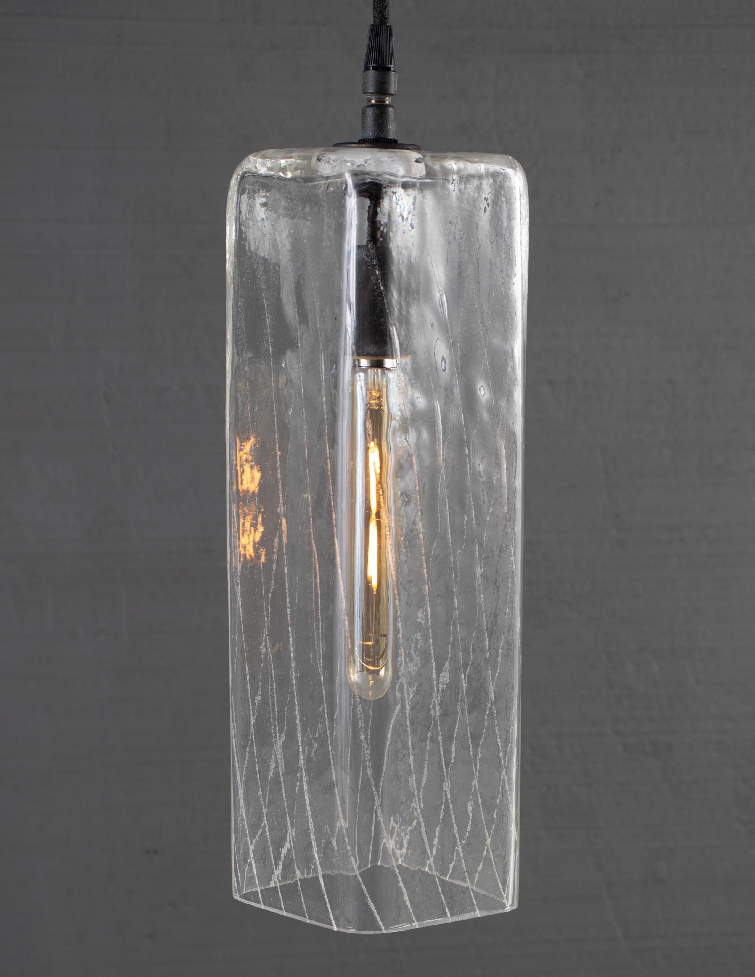 Mouth blown glass with Variegated Luminance

Bulb 1x medium base 30 watt incandescent

Handcrafted in Italy. Exclusive to Brendan Bass

Minimum hanging height: 12