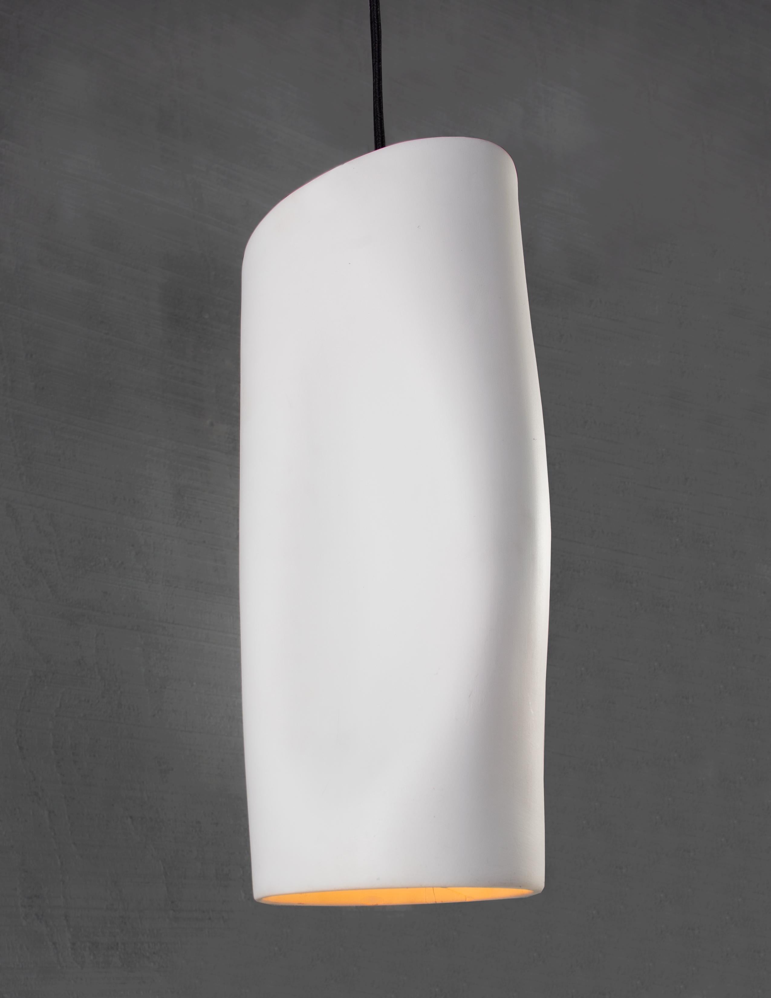 Hanging hand formed ceramic

Bulb 1 x medium base 60 watt incandescent.

The Nypa pendant is a modernist expression of simplicity and tailored elegance. Created for a modern interior, Nypa exhibits movement and geometry in its aesthetic. Crafted by