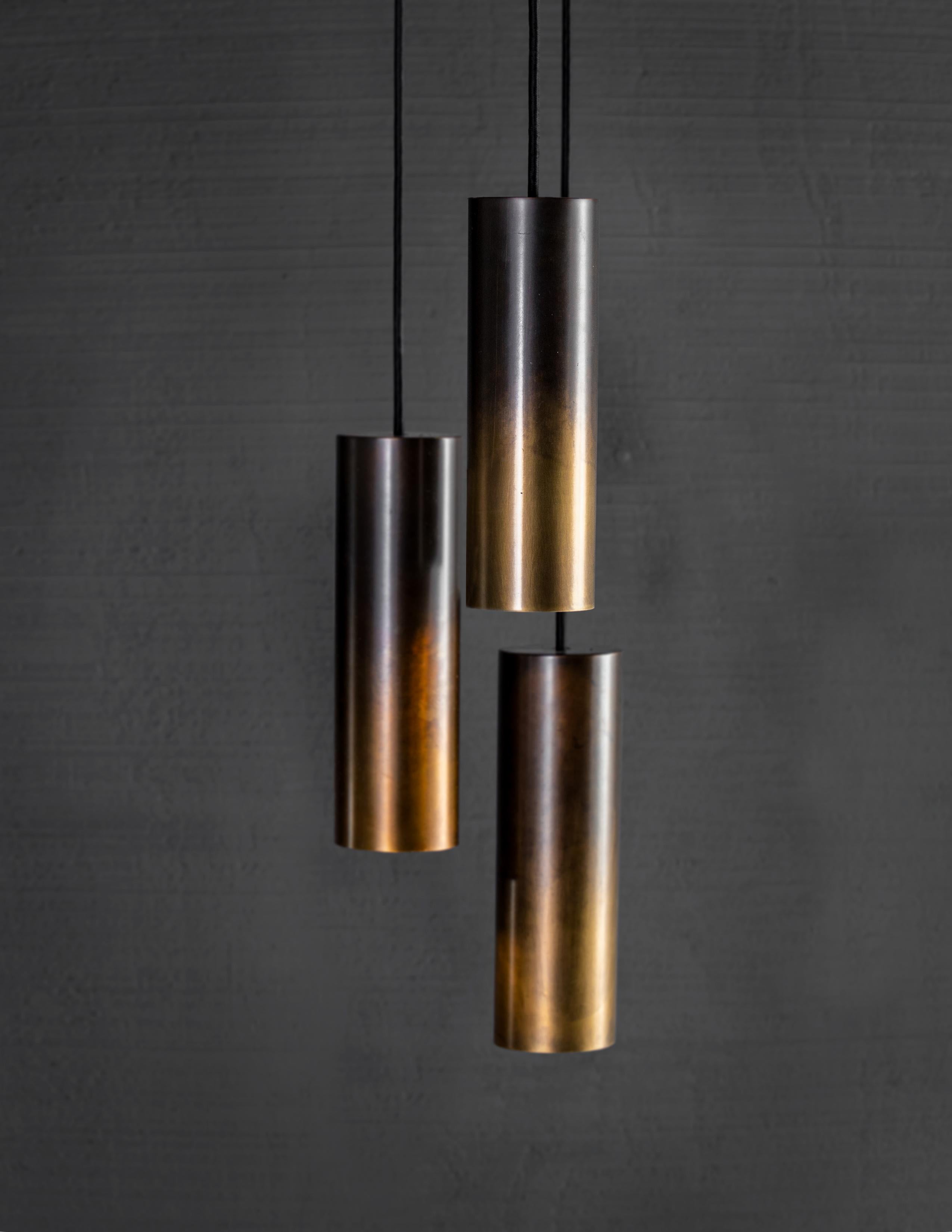 Brass tubular shaped light fixture. 

Bulb 1x medium base 60 watt incandescent. 5lbs

Handcrafted in Italy. Sold exclusively by Brendan Bass.

Measures: Minimum hanging height: N/A
Maximum hanging height: 68