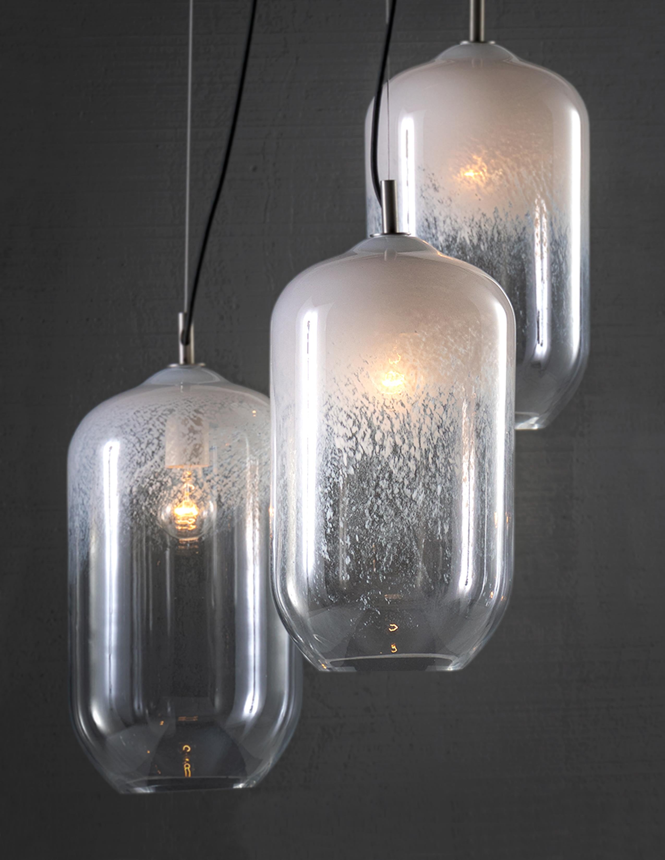 Decorative Glass. Mouth blown glass with variegated opaque tones

Bulb 1x medium base 60 watt incandescent

Handcrafted in Italy.

Minimum Hanging Height: N/A
Maximum Hanging Height: 72