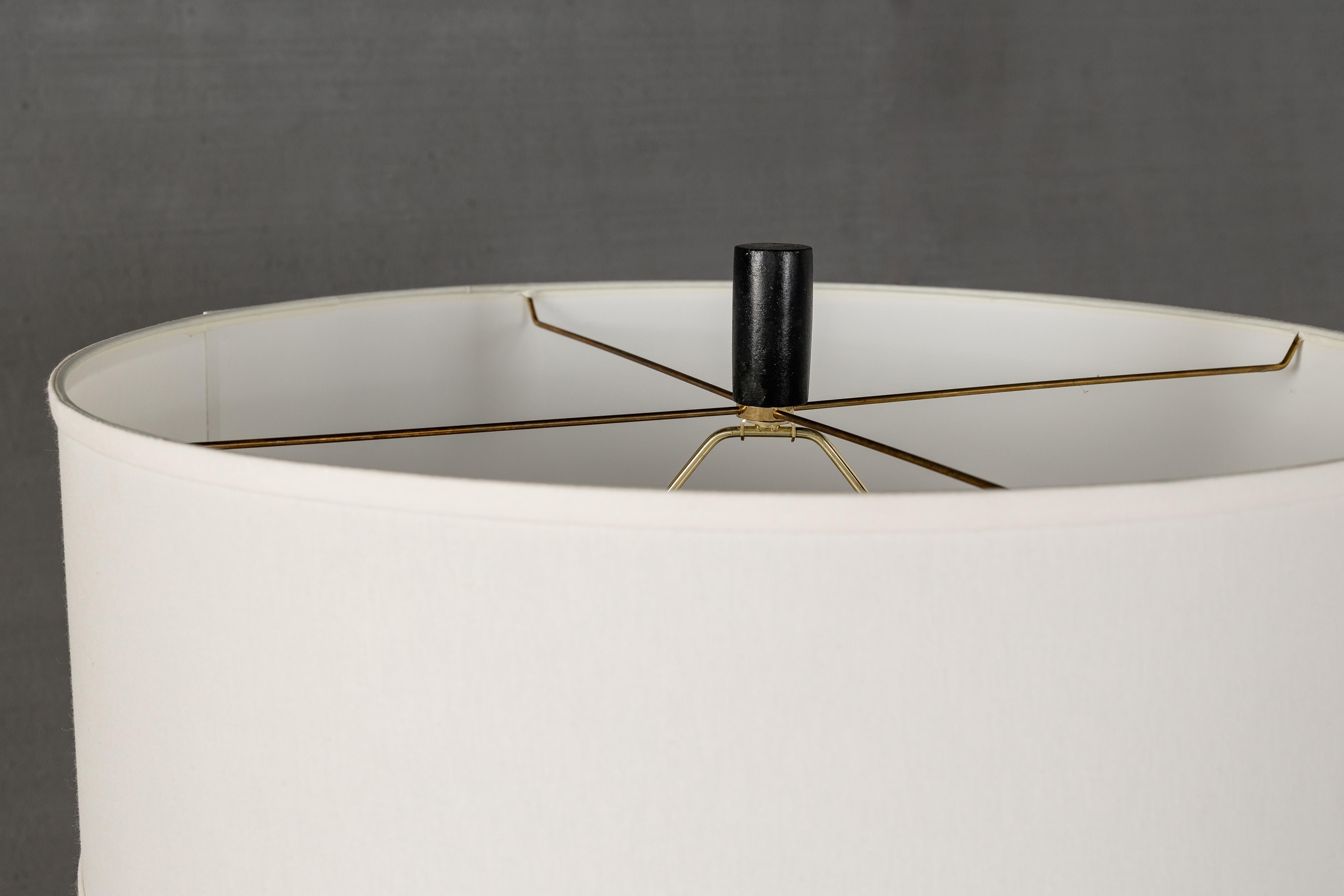 Stacked steel table lamp with white shade.

Designed by Brendan Bass, handcrafted in Italy.

Shade: 22.5