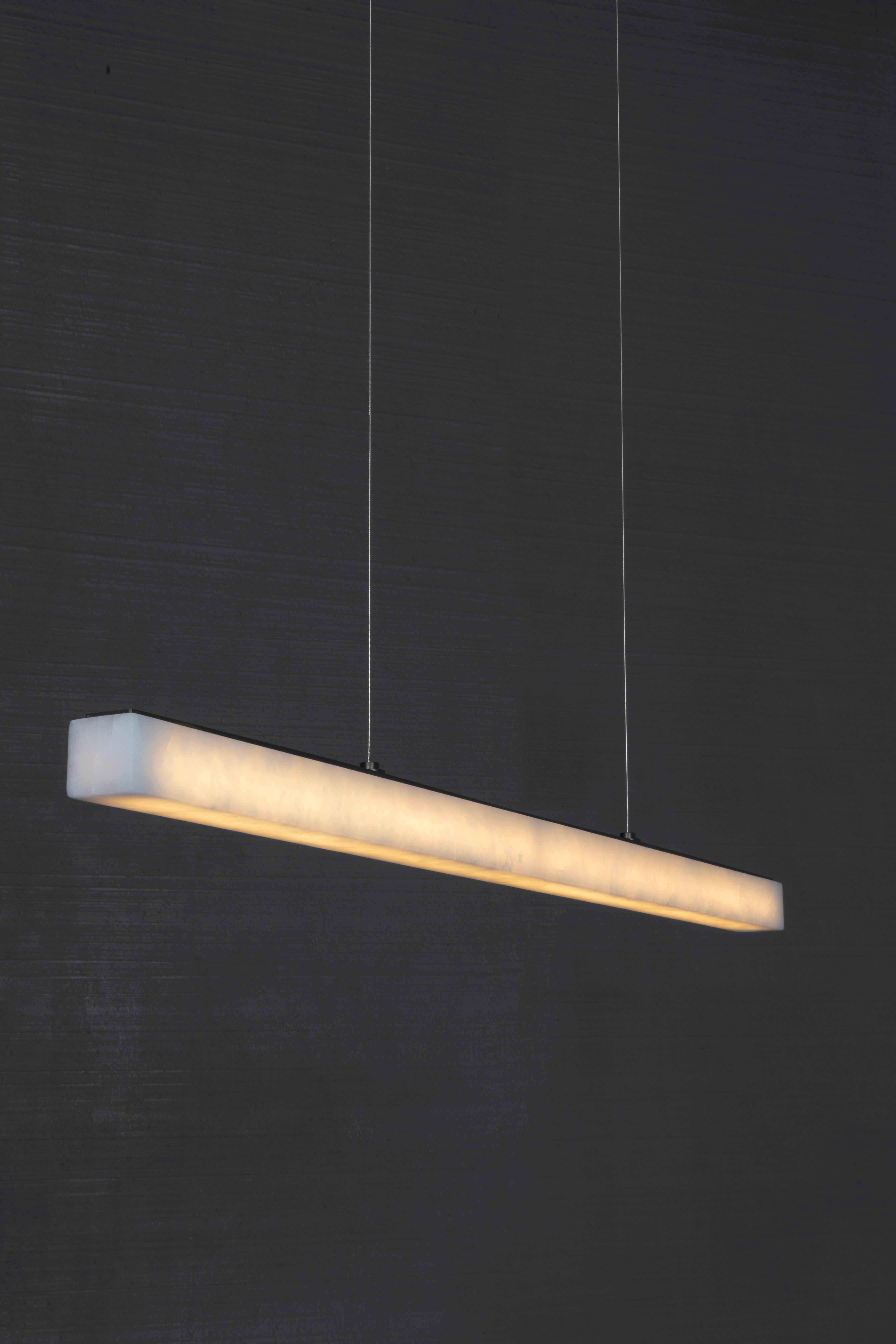 The Surimu pendant, alabaster modernist suspension light with burnished brass accents steel cable suspension. Available in two different lengths. Hand-crafted at our factory in Volterra, Italy. 

LED Illumination 

Handcrafted in Italy.